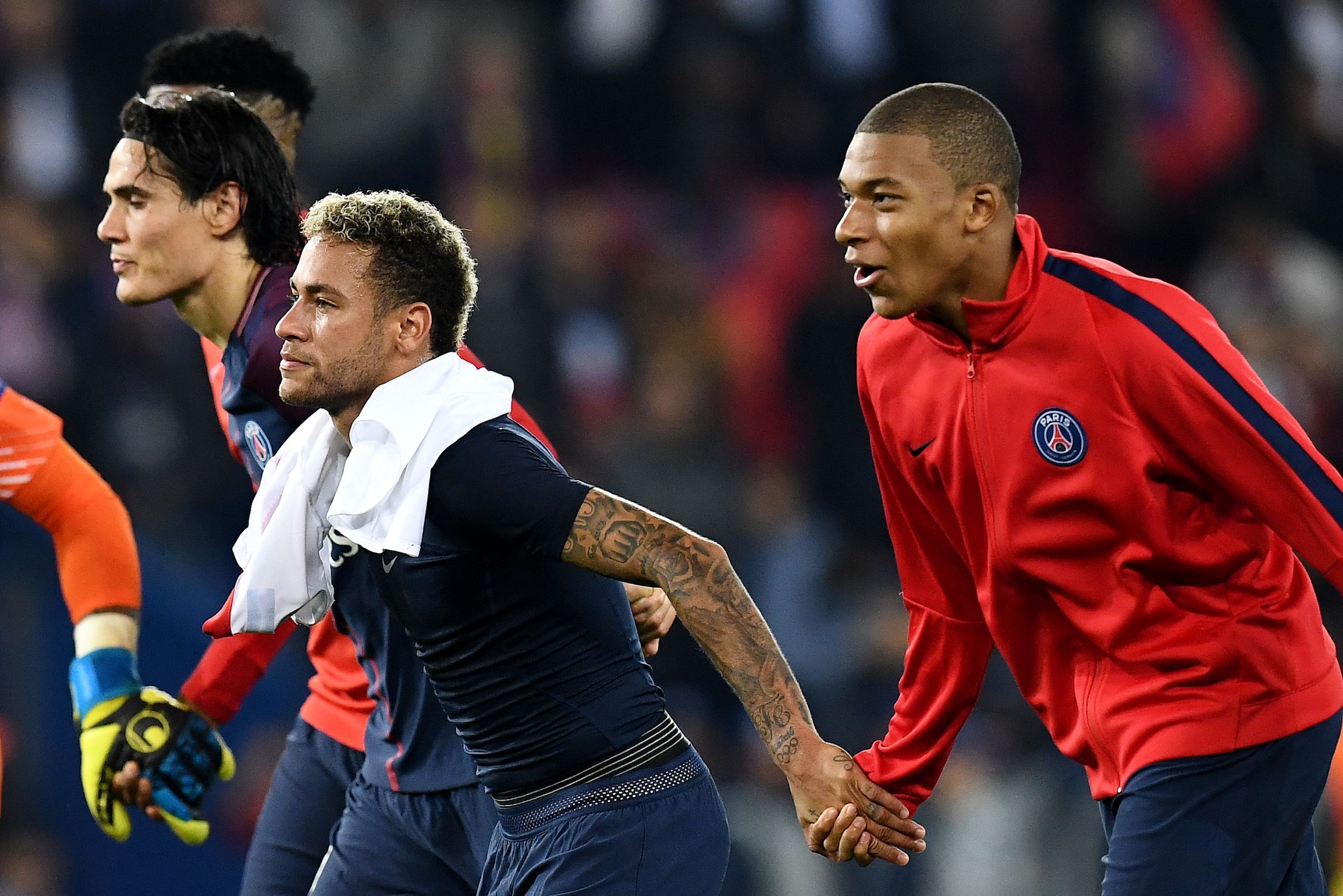 (from L) Paris Saint-Germain's French defender Presnel Kimpembe, Paris Saint-Germain's Uruguayan forward Edinson Cavani, Paris Saint-Germain's French forward Kylian Mbappe and Paris Saint-Germain's Brazilian forward Neymar celebrate after winning the UEFA