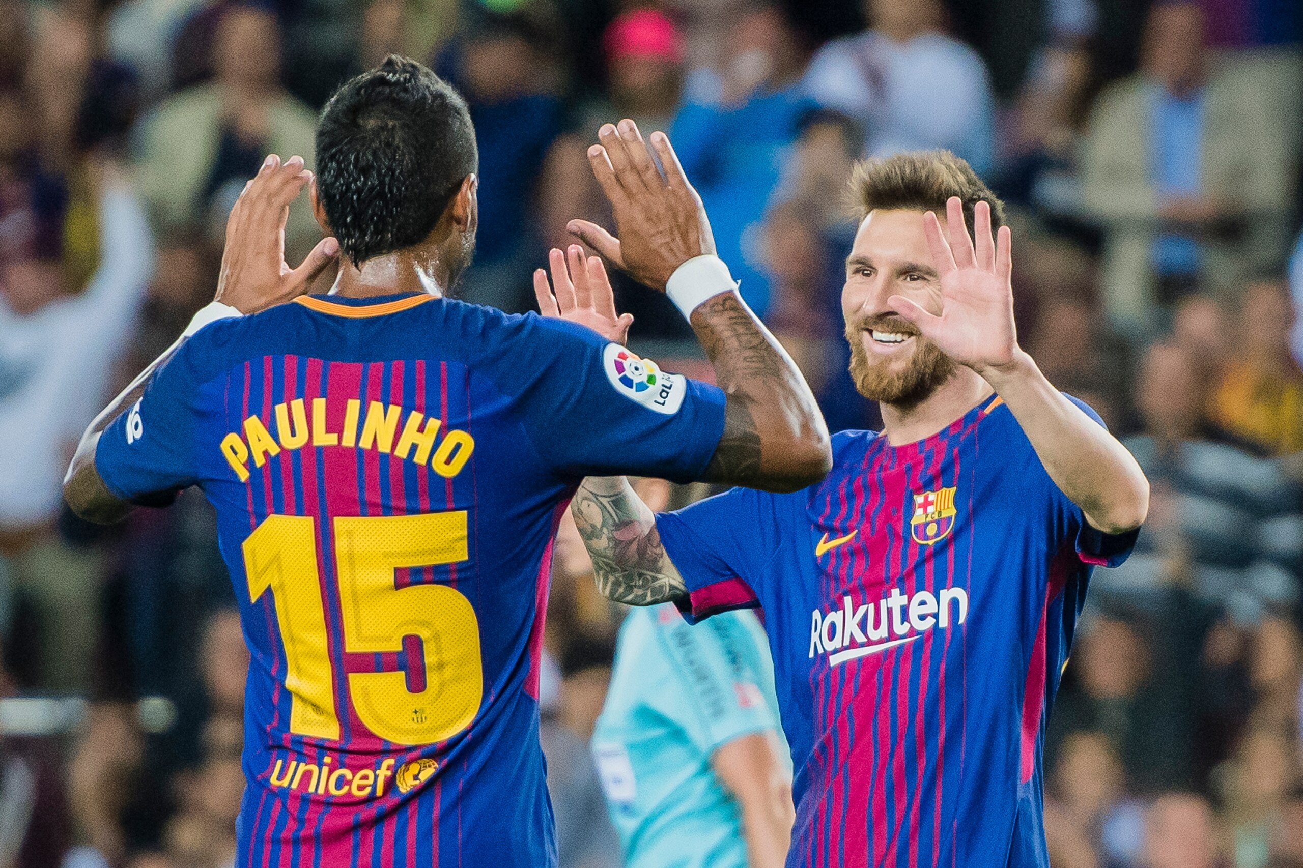 BARCELONA, SPAIN - SEPTEMBER 19: Lionel Andres Messi of FC Barcelona (R) celebrates after scoring his goal with Jose Paulo Bezerra Maciel Junior, Paulinho, of FC Barcelona(L) during the La Liga 2017-18 match between FC Barcelona and SD Eibar at Camp Nou o