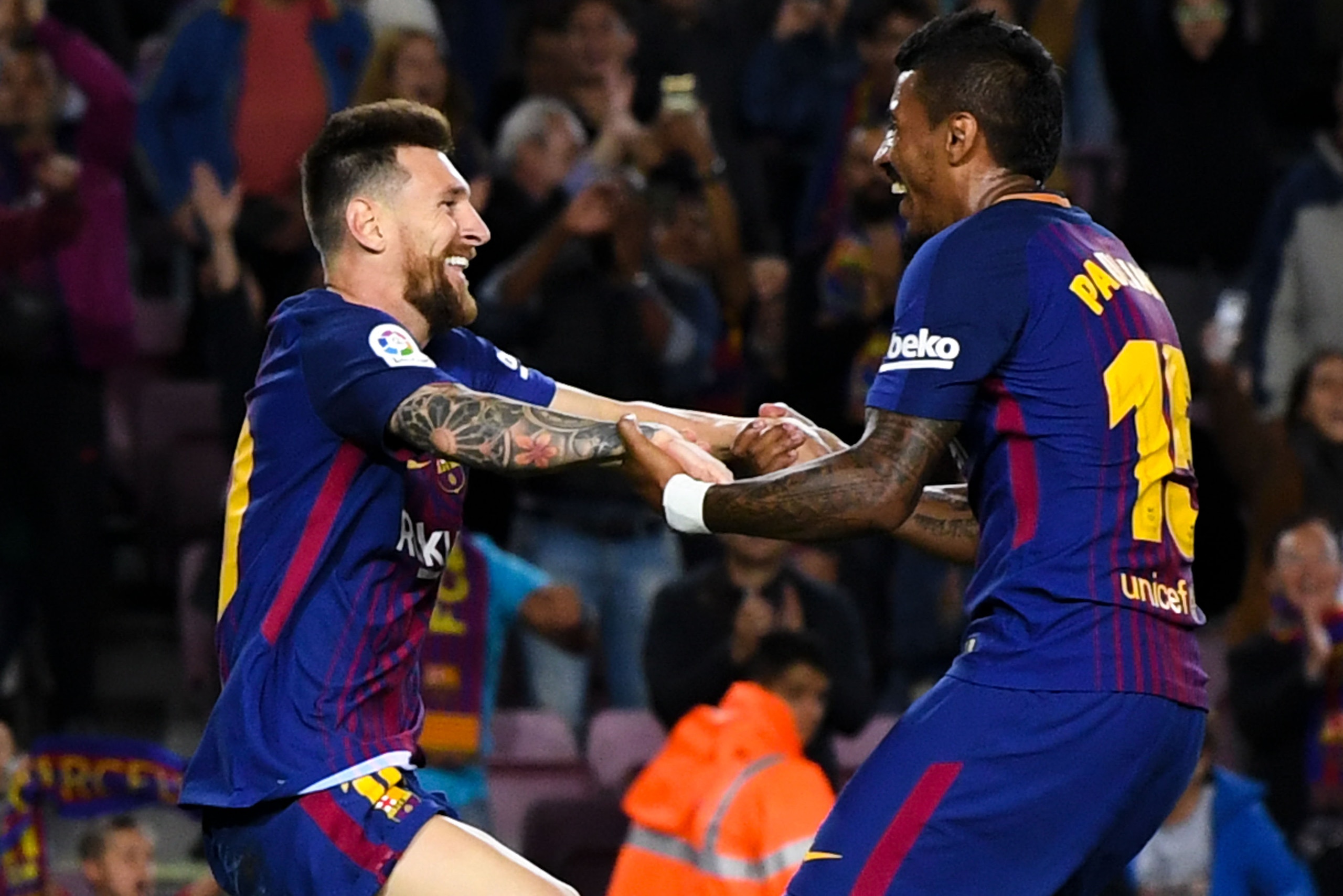BARCELONA, SPAIN - SEPTEMBER 19:  Lionel Messi of FC Barcelona celebrates with his team mate Paulinho after scoring his team's fifth goal during the La Liga match between Barcelona and SD Eibar at Camp Nou on September 19, 2017 in Barcelona, Spain.  (Phot