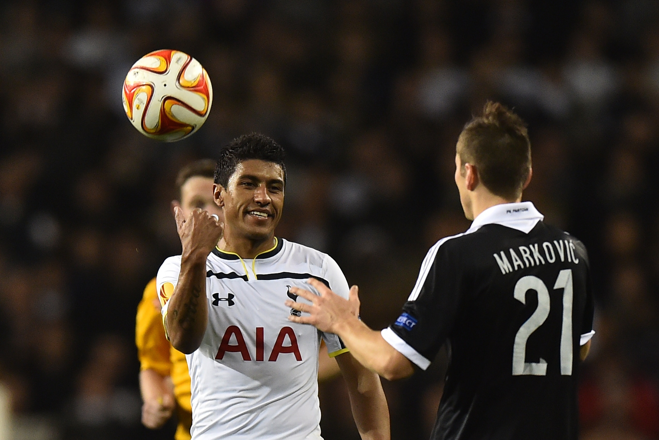 Tottenham Hotspur's Brazilian midfielder Paulinho (L) throws the ball away behind him after a free kick decision during the UEFA Europa League group C football match between Tottenham Hotspur and Partizan Belgrade at White Hart Lane in north London, on No