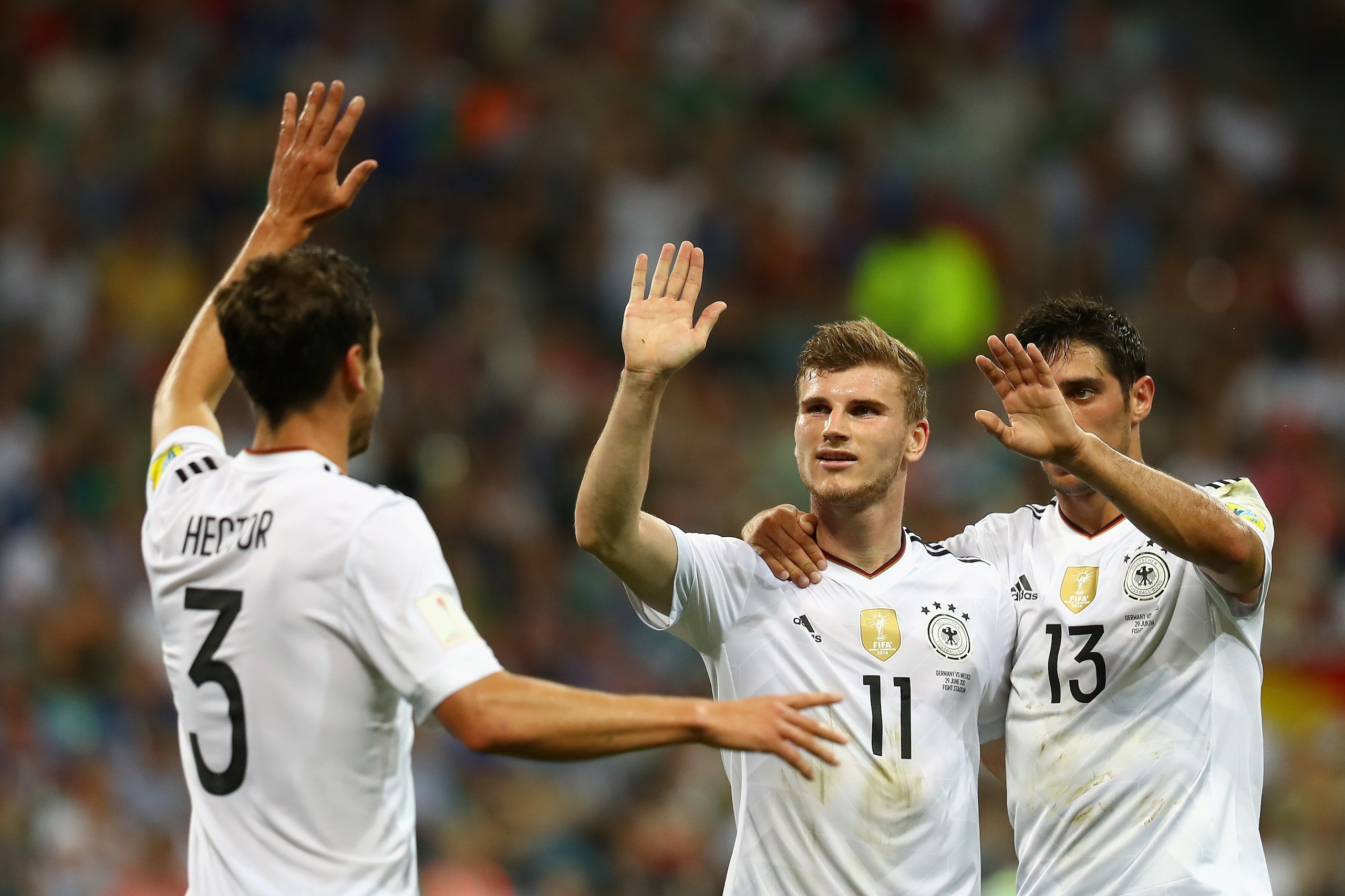 SOCHI, RUSSIA - JUNE 29: Timo Werner (C) of Germany celebrates scoring his side's third goal with his team mates Jonas Hector (L) and Lars Stindl (R) of Germany during the FIFA Confederations Cup Russia 2017 Semi-Final between Germany and Mexico at Fisht SOCHI, RUSSIA - JUNE 29: Timo Werner (C) of Germany celebrates scoring his side's third goal with his team mates Jonas Hector (L) and Lars Stindl (R) of Germany during the FIFA Confederations Cup Russia 2017 Semi-Final between Germany and Mexico at Fisht
