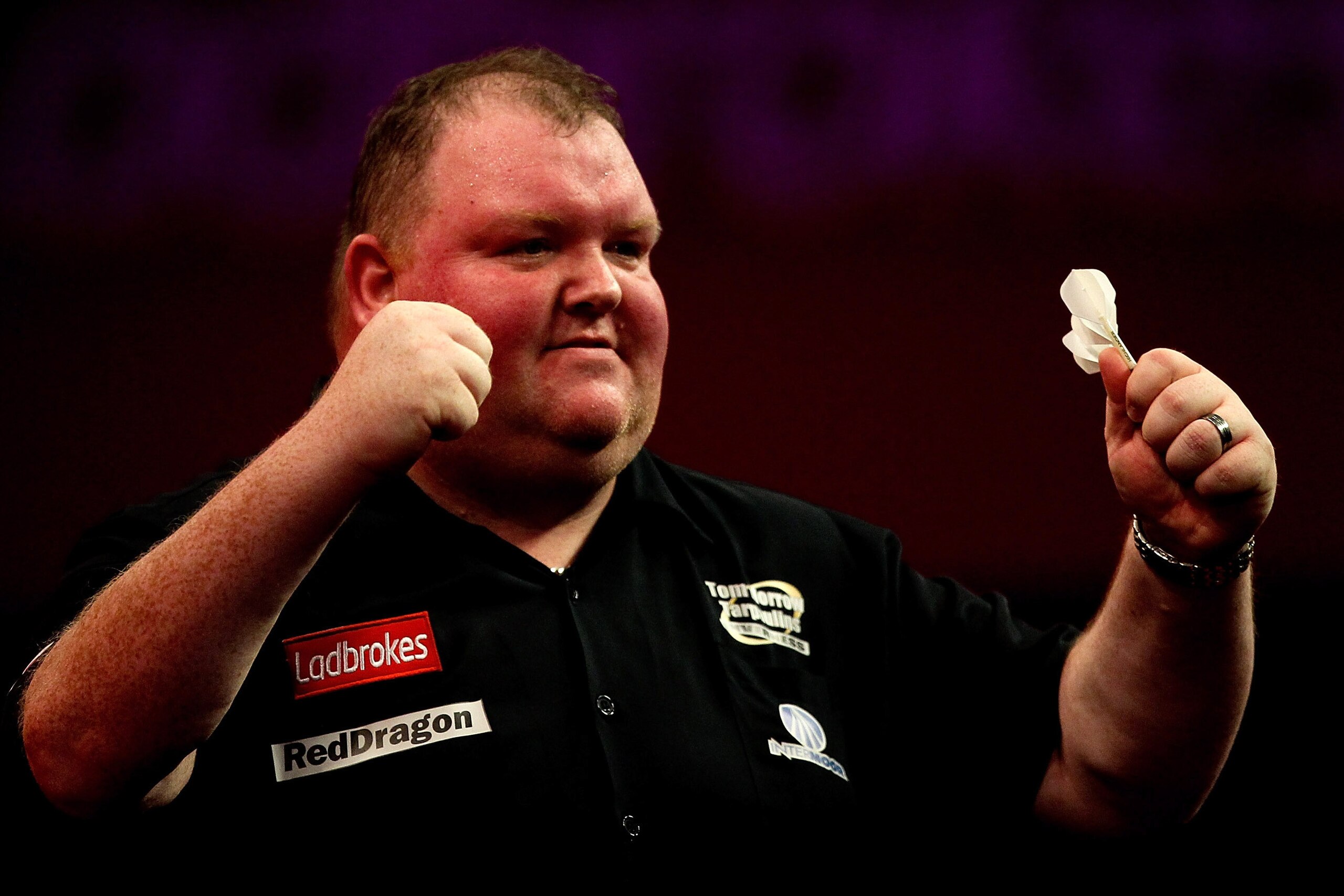 LONDON, ENGLAND - DECEMBER 15: John Henderson of Scotland celebrates after defeating Dave Chisnall of England during his first round match on day three of the Ladbrokes.com World Darts Championships at Alexandra Palace on December 15, 2013 in London, Eng LONDON, ENGLAND - DECEMBER 15: John Henderson of Scotland celebrates after defeating Dave Chisnall of England during his first round match on day three of the Ladbrokes.com World Darts Championships at Alexandra Palace on December 15, 2013 in London, Eng