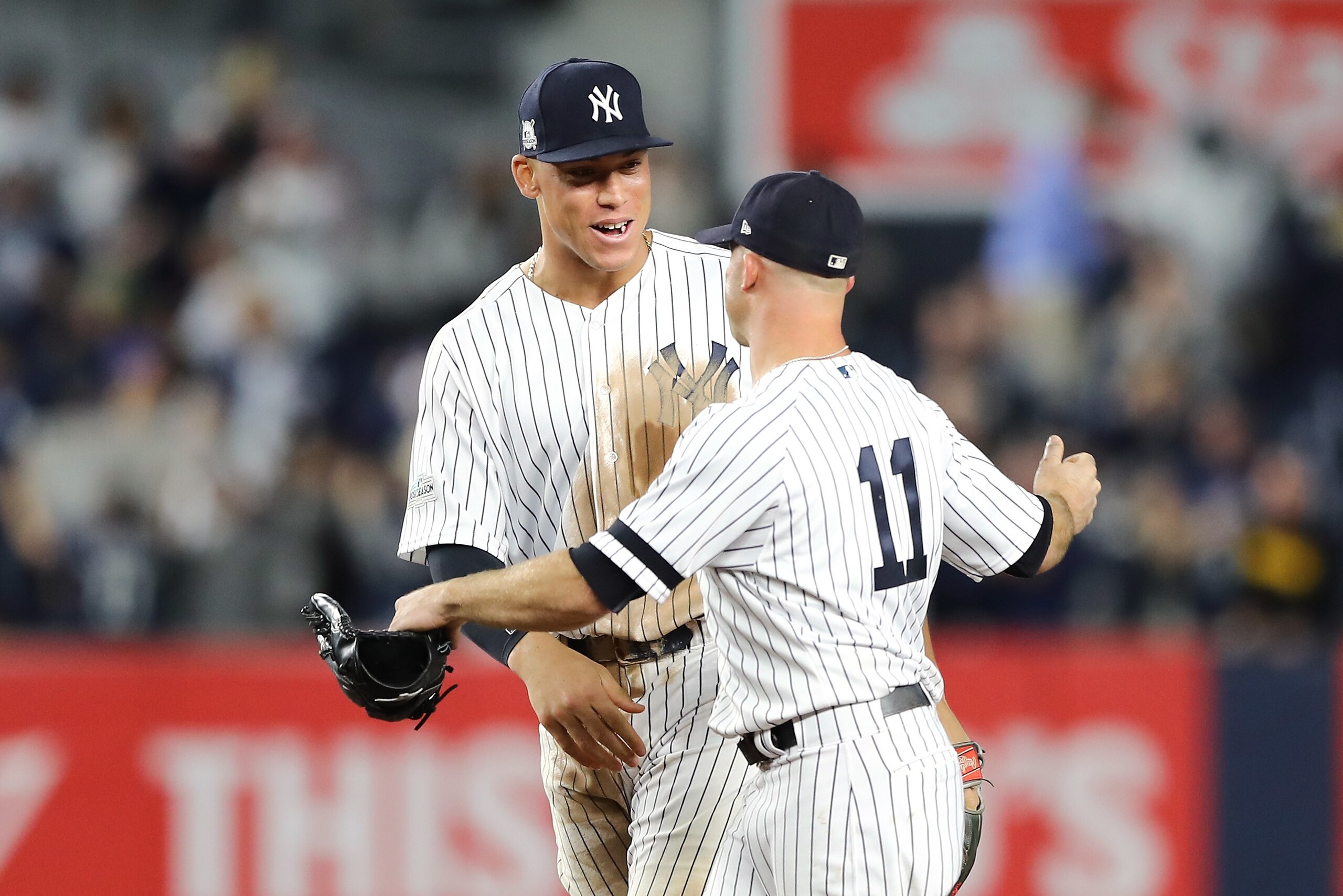 NEW YORK, NY - OCTOBER 03:  Aaron Judge #99 of the New York Yankees celebrates with Brett Gardner #11 after defeating the Minnesota Twins in the American League Wild Card Game at Yankee Stadium on October 3, 2017 in the Bronx borough of New York City. The