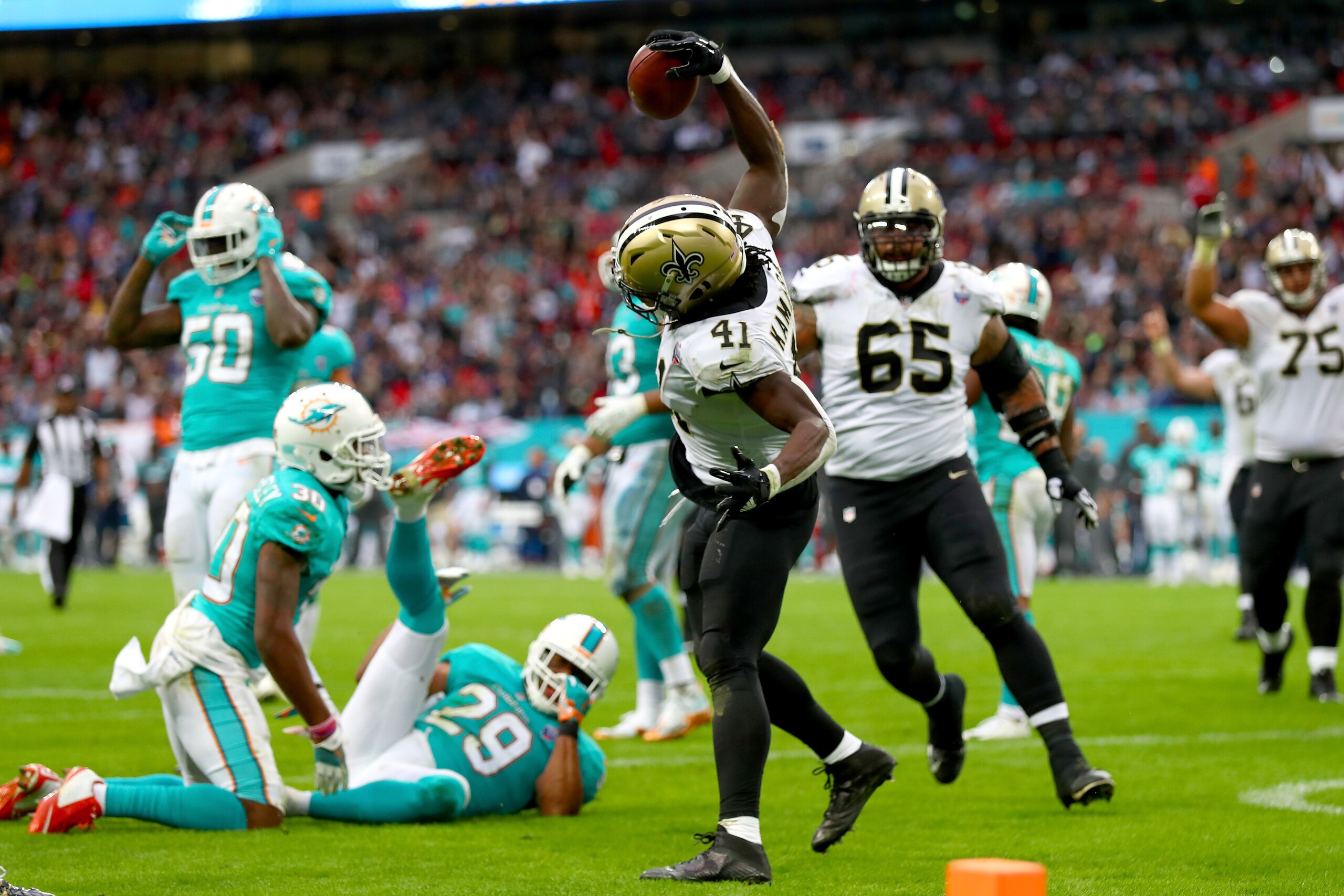 LONDON, ENGLAND - OCTOBER 01:  Alvin Kamara of the New Orleans Saints celebrates his touchdown during the NFL match between New Orleans Saints and Miami Dolphins at Wembley Stadium on October 1, 2017 in London, England.  (Photo by Clive Rose/Getty Images)