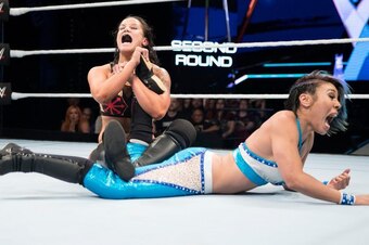 Shayna Baszler has Mia Yim in trouble with an ankle lock.