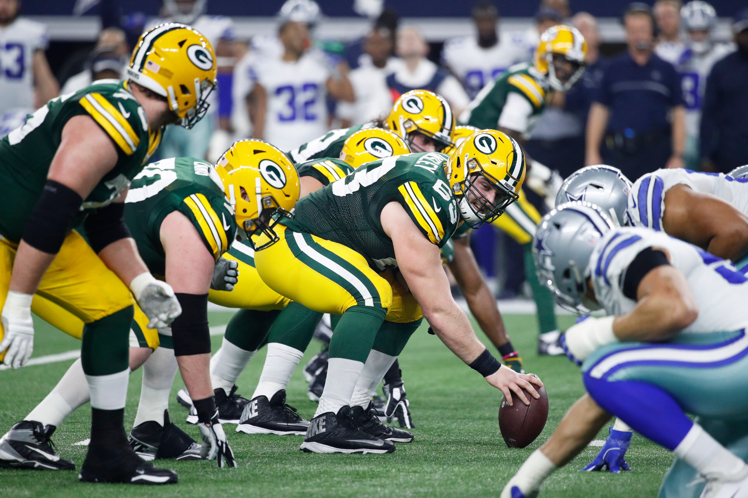 ARLINGTON, TX - JANUARY 15: Corey Linsley #63 of the Green Bay Packers gets set to snap the ball during the NFC Divisional Playoff game against the Dallas Cowboys at AT&T Stadium on January 15, 2017 in Arlington, Texas. The Packers defeated the Cowboys 34
