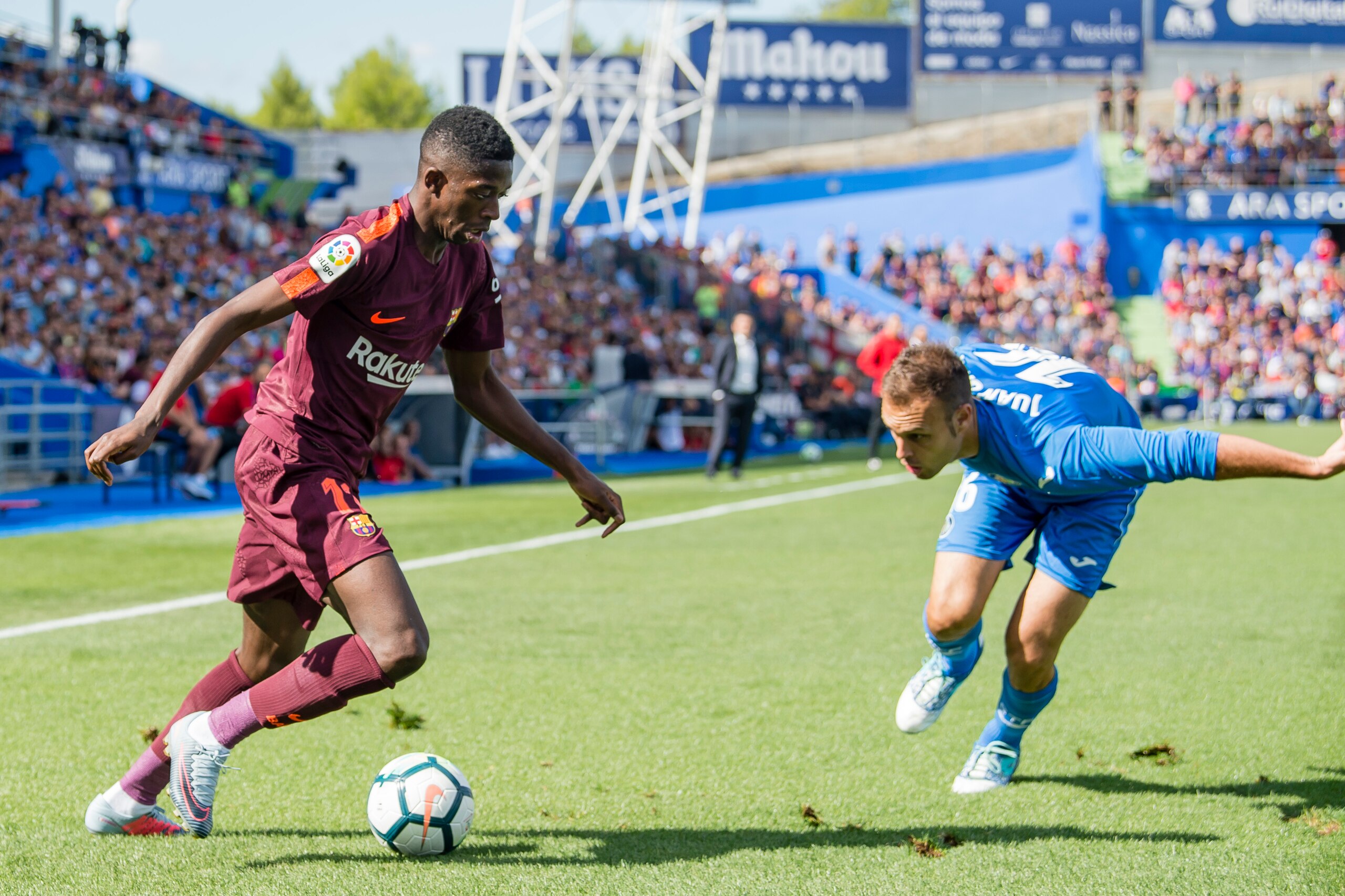GETAFE, SPAIN - SEPTEMBER 16: Ousmane Dembele of FC Barcelona (L) fights for the ball with Juan Torres Ruiz, Cala, of Getafe CF (R) during the La Liga 2017-18 match between Getafe CF and FC Barcelona at Coliseum Alfonso Perez on 16 September 2017 in Getaf