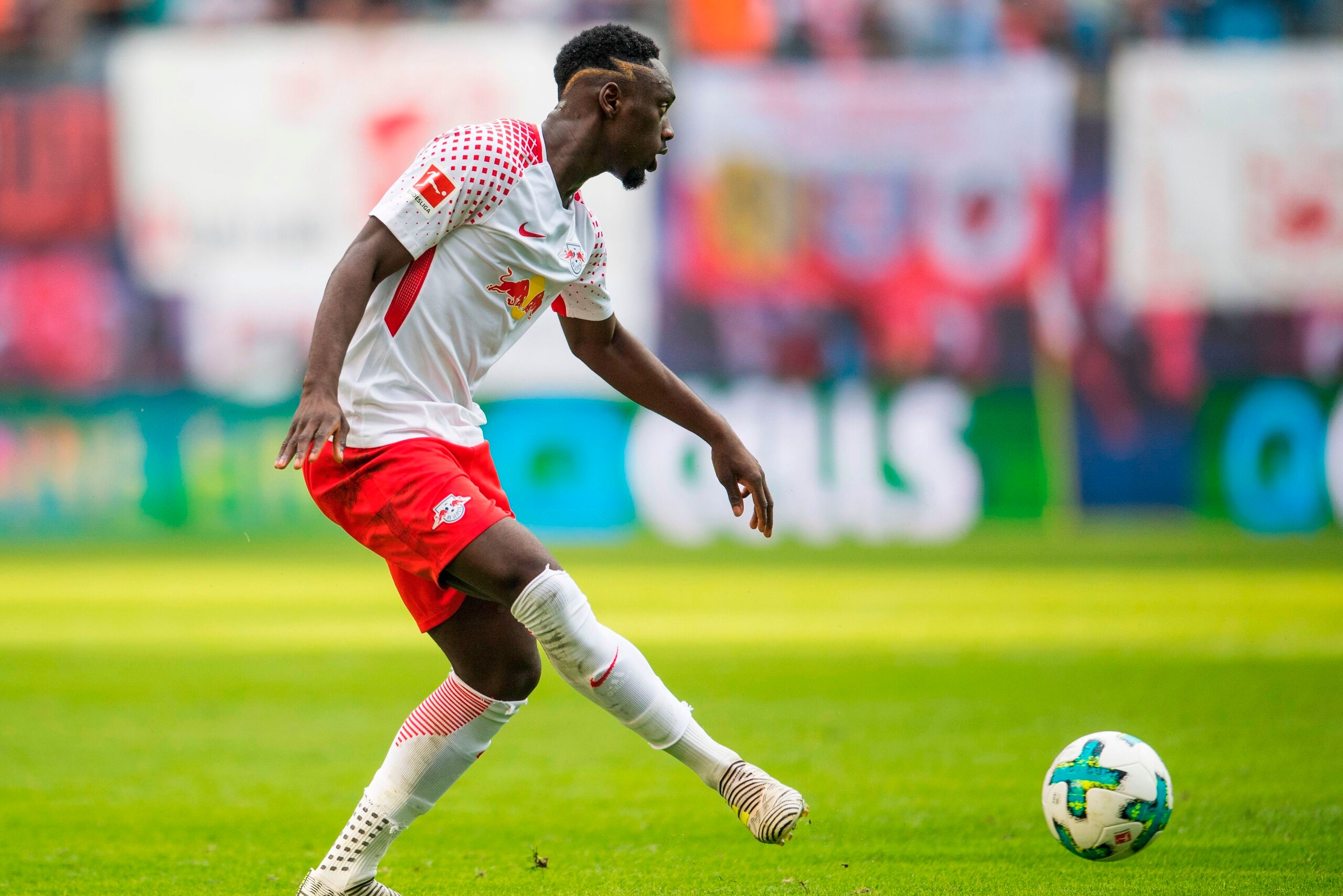 Leipzig´s French forward Jean-Kevin Augustin plays the ball during the German first division Bundesliga football match between RB Leipzig and Eintracht Frankfurt in Leipzig, eastern Germany on September 23, 2017.  / AFP PHOTO / ROBERT MICHAEL / RESTRICTIO