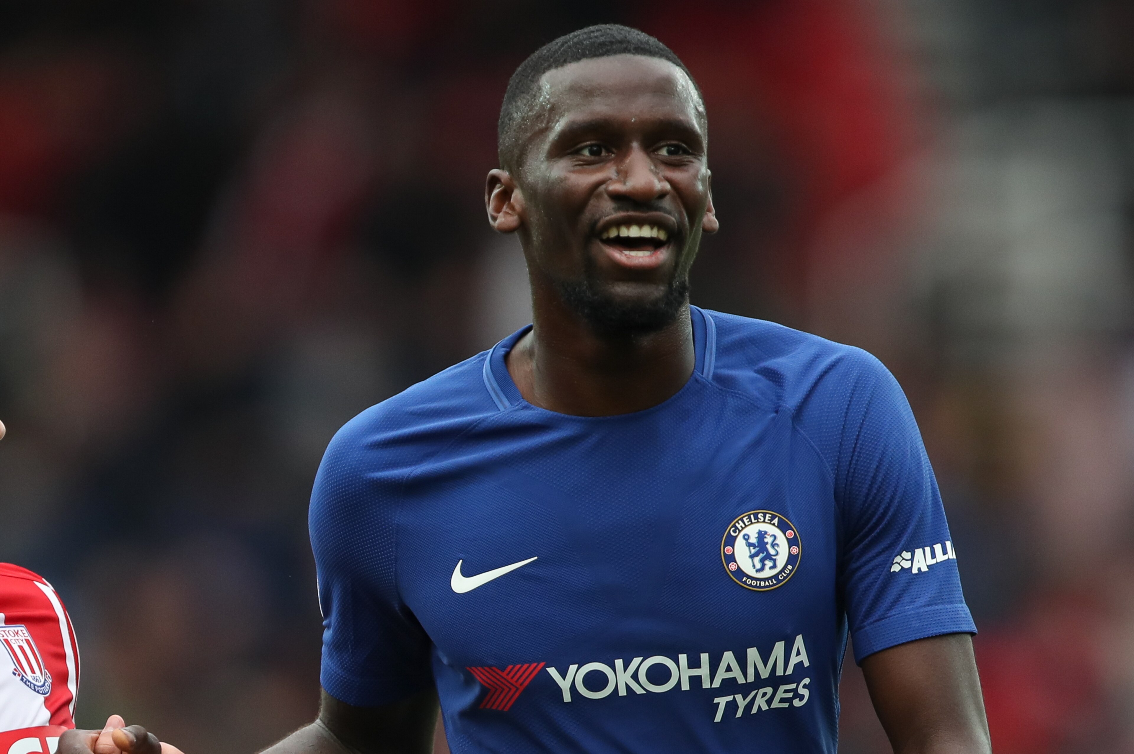 STOKE ON TRENT, ENGLAND - SEPTEMBER 23: Xherdan Shaqiri of Stoke City and Antonio Rudiger of Chelsea share a joke  during the Premier League match between Stoke City and Chelsea at Bet365 Stadium on September 23, 2017 in Stoke on Trent, England. (Photo by