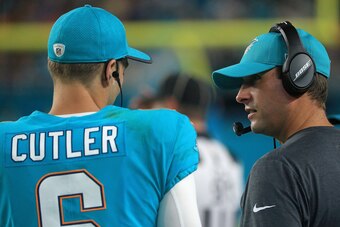 MIAMI GARDENS, FL - AUGUST 17:  Jay Cutler #6 of the Miami Dolphins talks with head coach Adam Gase during a preseason game against the Baltimore Ravens at Hard Rock Stadium on August 17, 2017 in Miami Gardens, Florida.  (Photo by Mike Ehrmann/Getty Image