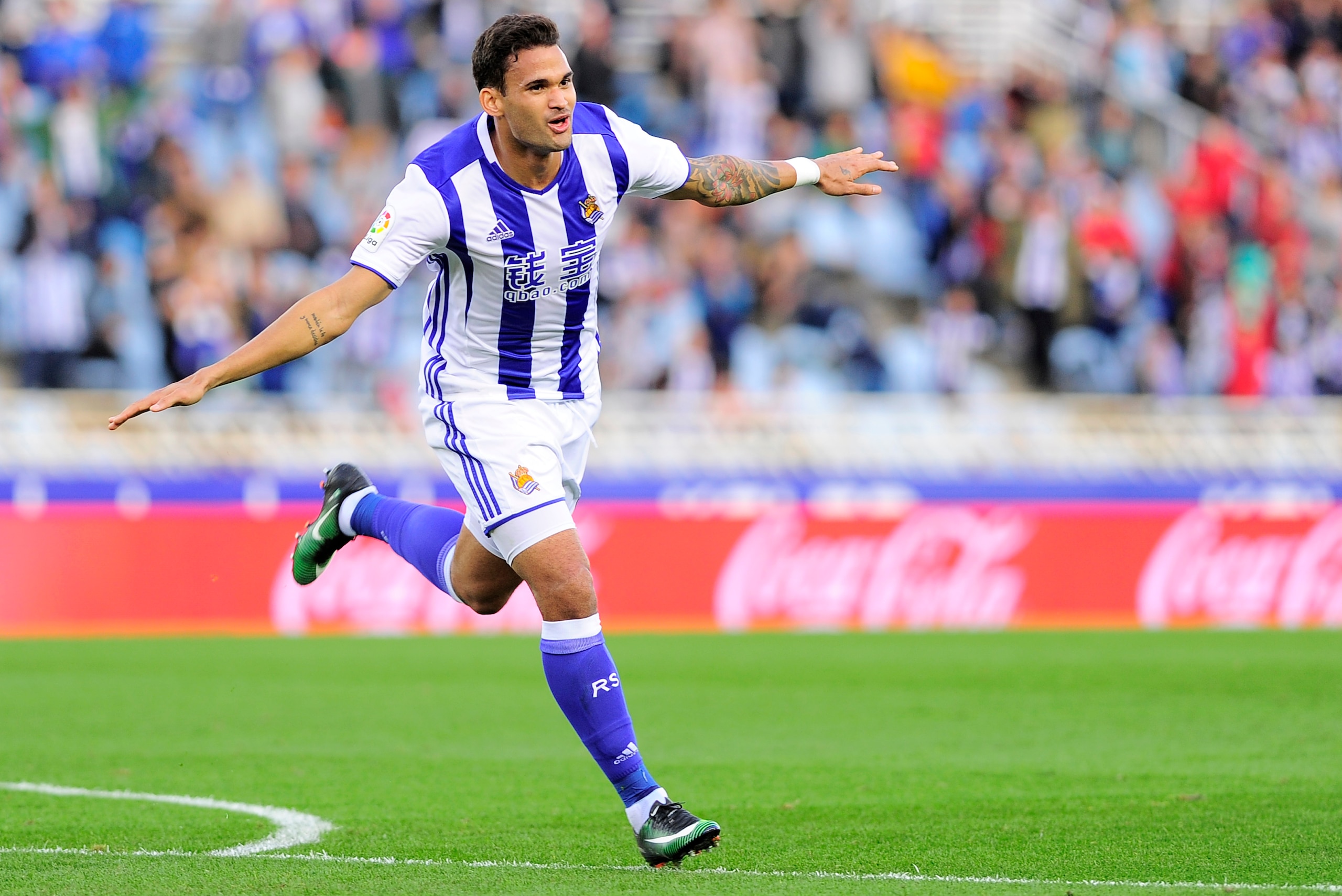Real Sociedad's Brazilian forward Willian Jose celebrates after scoring his team's second goal during the Spanish league football match Real Sociedad vs Valencia CF at the Anoeta stadium in San Sebastian on December 10, 2016. / AFP / ANDER GILLENEA       