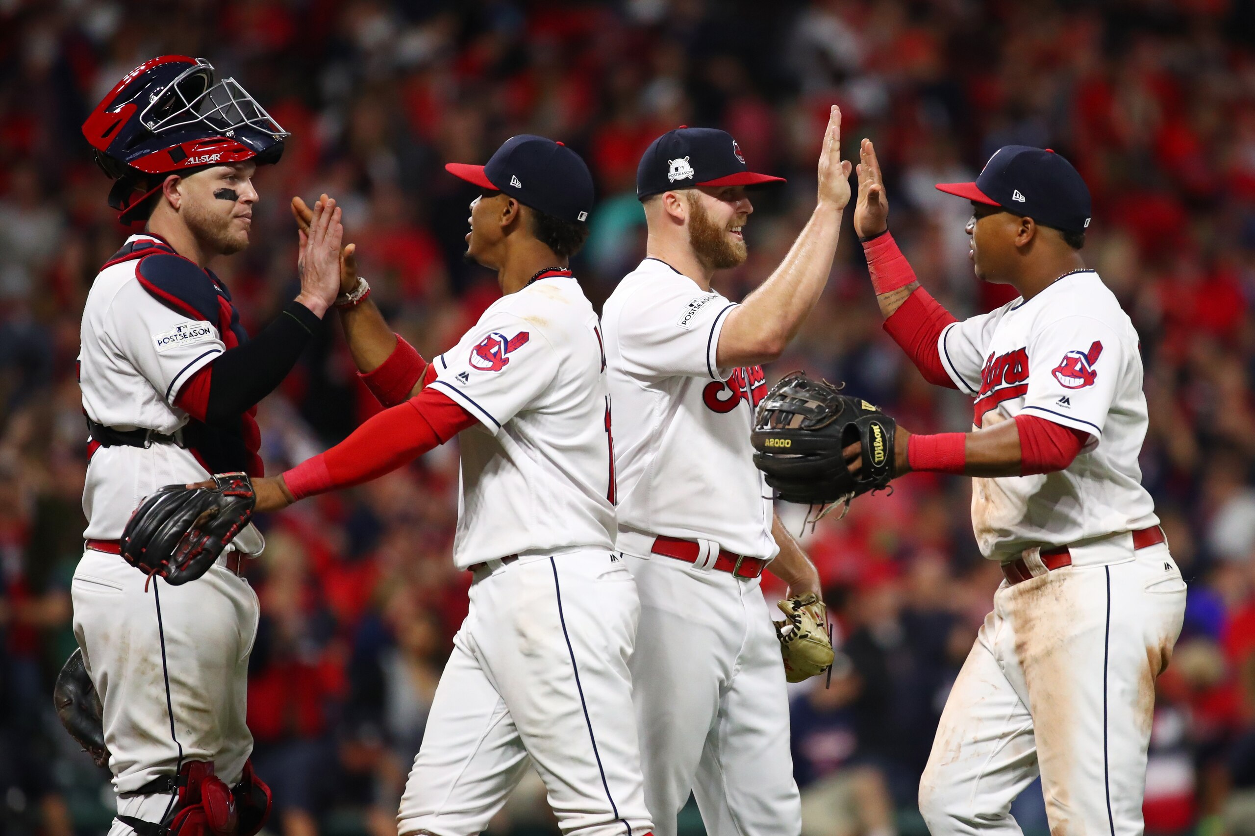 CLEVELAND, OH - OCTOBER 05: Roberto Perez #55, Francisco Lindor #12, Cody Allen #37 and Jose Ramirez #11 of the Cleveland Indians celebrate their teams victory over the New York Yankees in game one of the American League Division Series at Progressive Fie