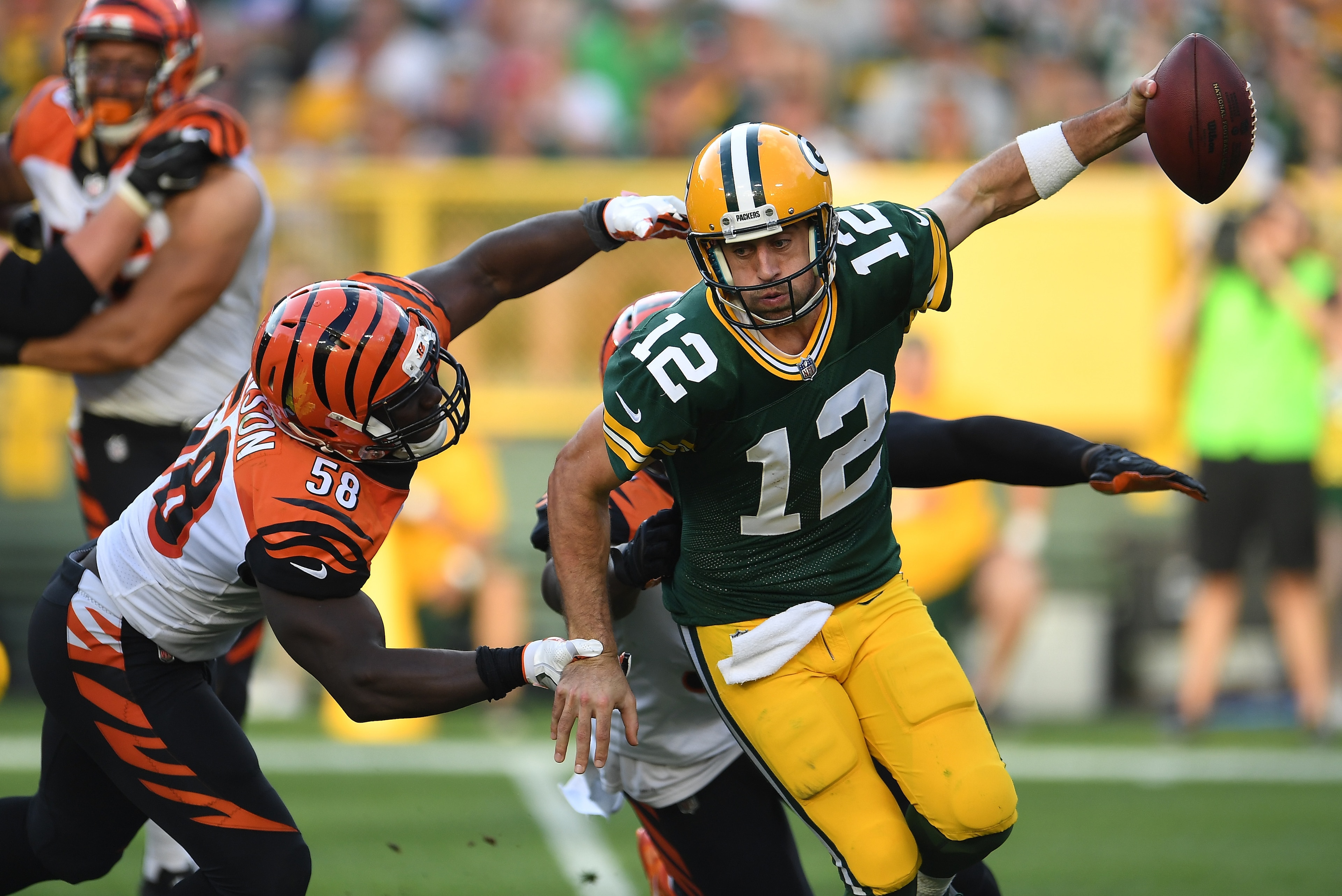 GREEN BAY, WI - SEPTEMBER 24:  Aaron Rodgers #12 of the Green Bay Packers is sacked by Carl Lawson #58 and Chris Smith #94 of the Cincinnati Bengals during the third quarter at Lambeau Field on September 24, 2017 in Green Bay, Wisconsin.  (Photo by Stacy 