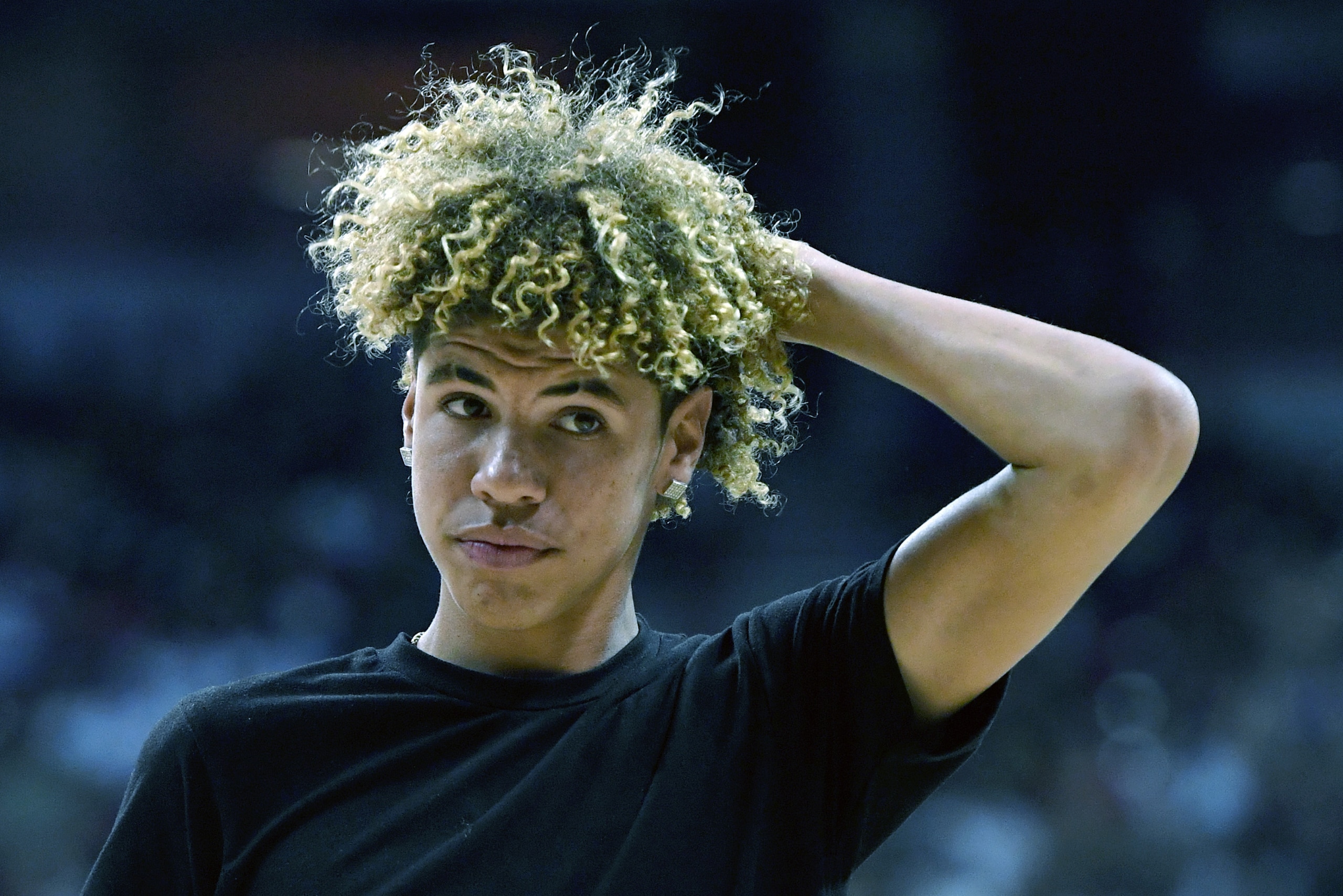 LAS VEGAS, NV - JULY 07:  LaMelo Ball, brother of Lonzo Ball #2 of the Los Angeles Lakers, walks off the court after shooting baskets as part of a promotion during a timeout of a 2017 Summer League game between the Lakers and the Los Angeles Clippers at t