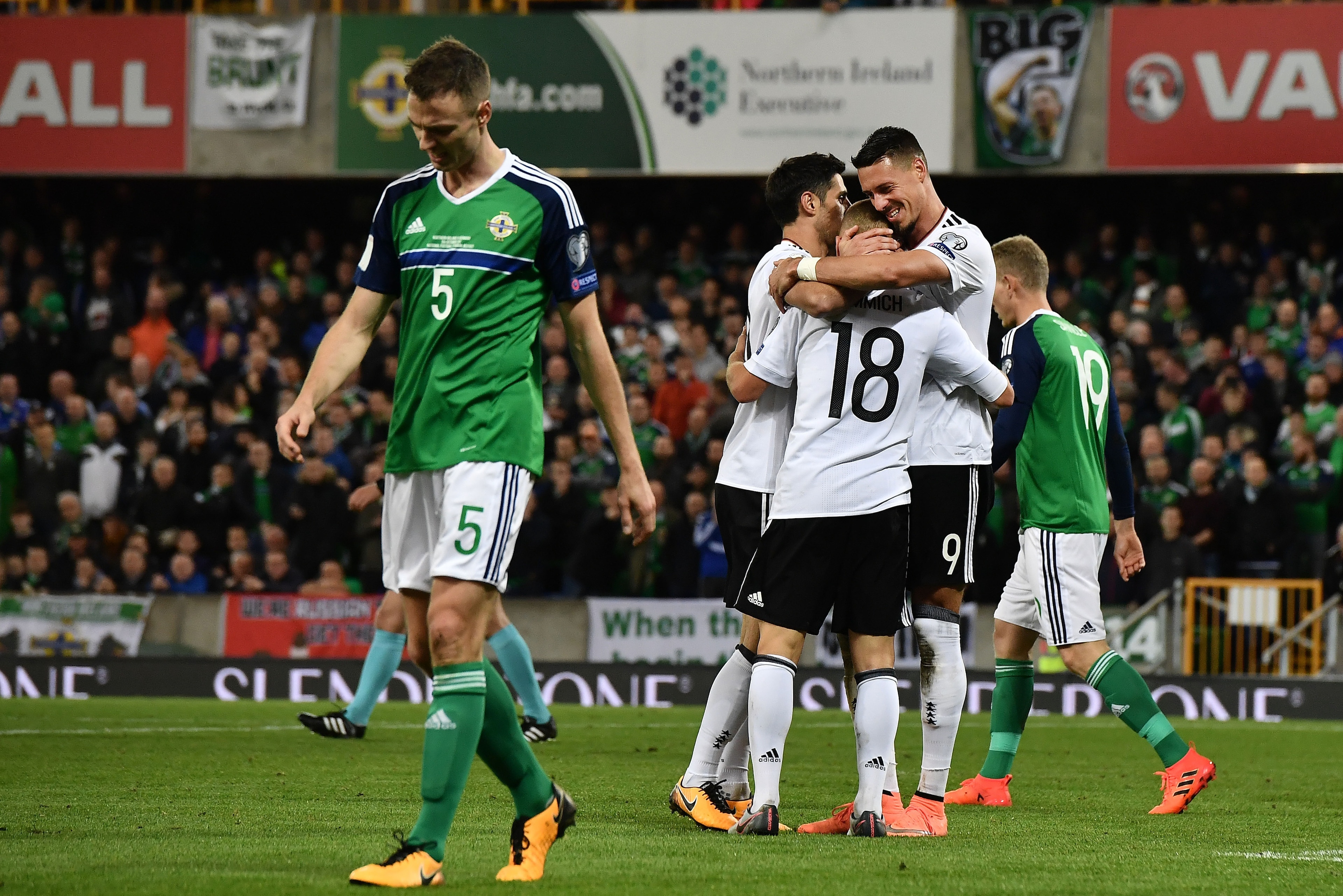 BELFAST, NORTHERN IRELAND - OCTOBER 05: Joshua Kimmich of Germany is congratulated by team mates after scoring his side's third goal during the FIFA 2018 World Cup Qualifier between Northern Ireland and Germany at Windsor Park on October 5, 2017 in Belfas