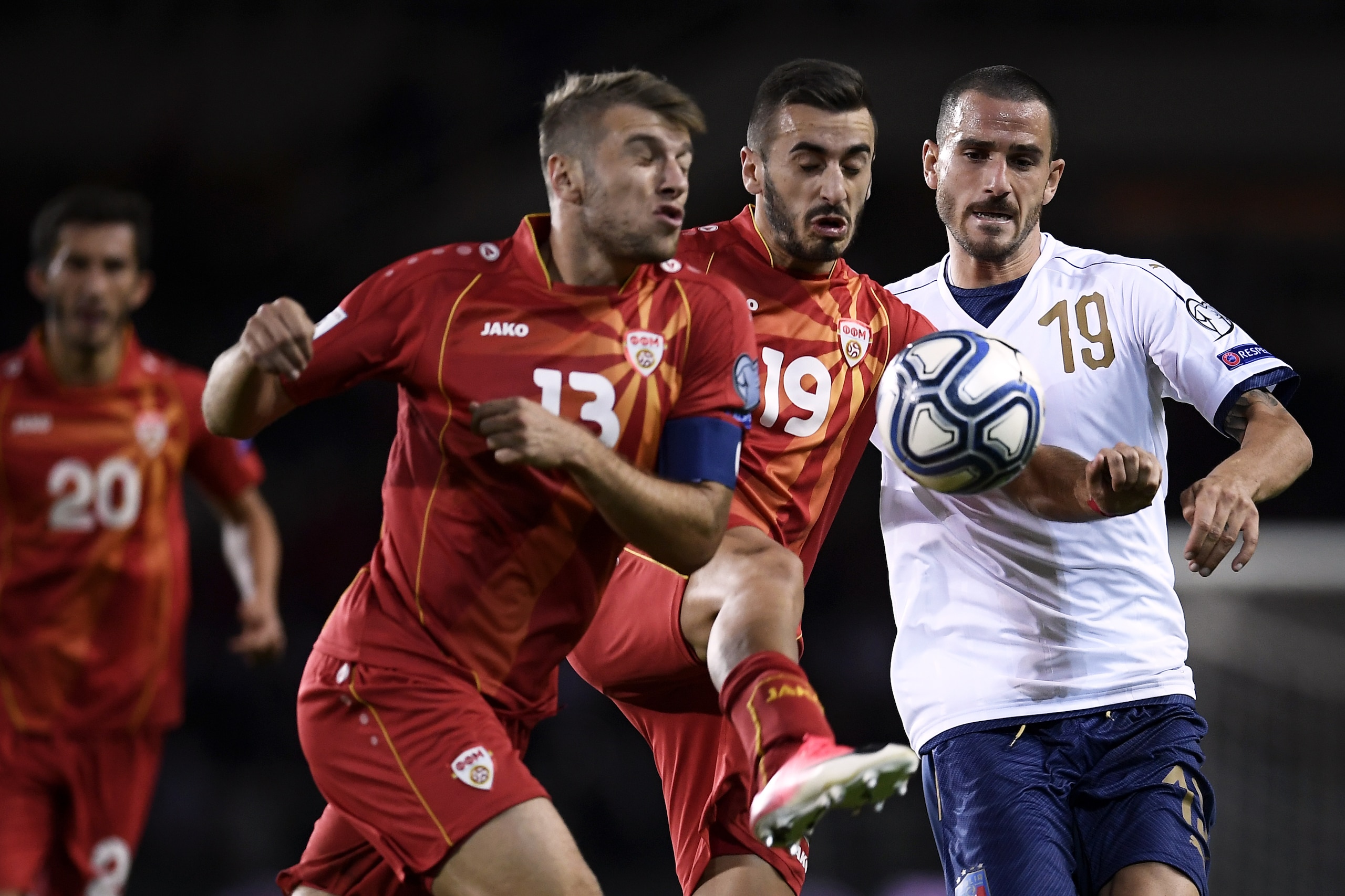 Macedonia's defender Stefan Ristovski (L), Macedonia's forward Marjan Radeski (C) and Italy's defender Leonardo Bonucci (R) fight for the ball during the FIFA World Cup 2018 qualification football match between Italy and Macedonia on October 6, 2017 at th