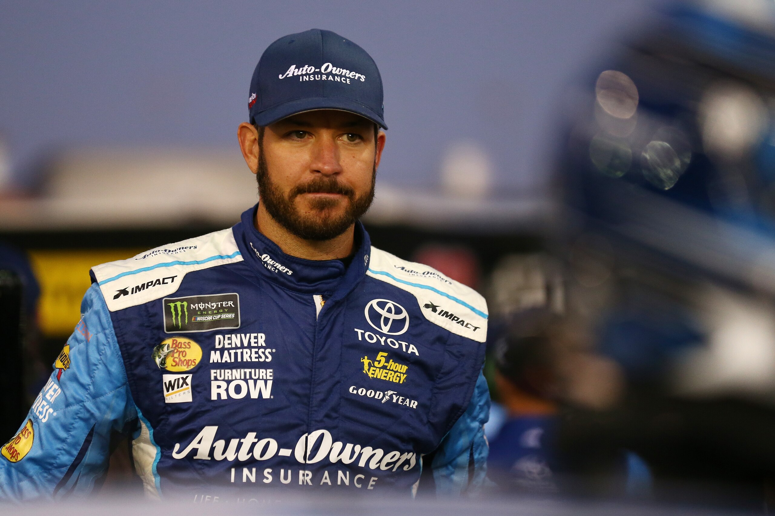 CHARLOTTE, NC - OCTOBER 06:  Martin Truex Jr., driver of the #78 Auto-Owners Insurance Toyota, stands on the grid during qualifying for the Monster Energy NASCAR Cup Series Bank of America 500 at Charlotte Motor Speedway on October 6, 2017 in Charlotte, N