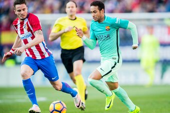MADRID, SPAIN - FEBRUARY 26: Neymar da Silva Santos Junior (r) of FC Barcelona fights for the ball with Saul Niguez Esclapez of Atletico de Madrid during their La Liga match between Atletico de Madrid and FC Barcelona at the Santiago Bernabeu Stadium on 2