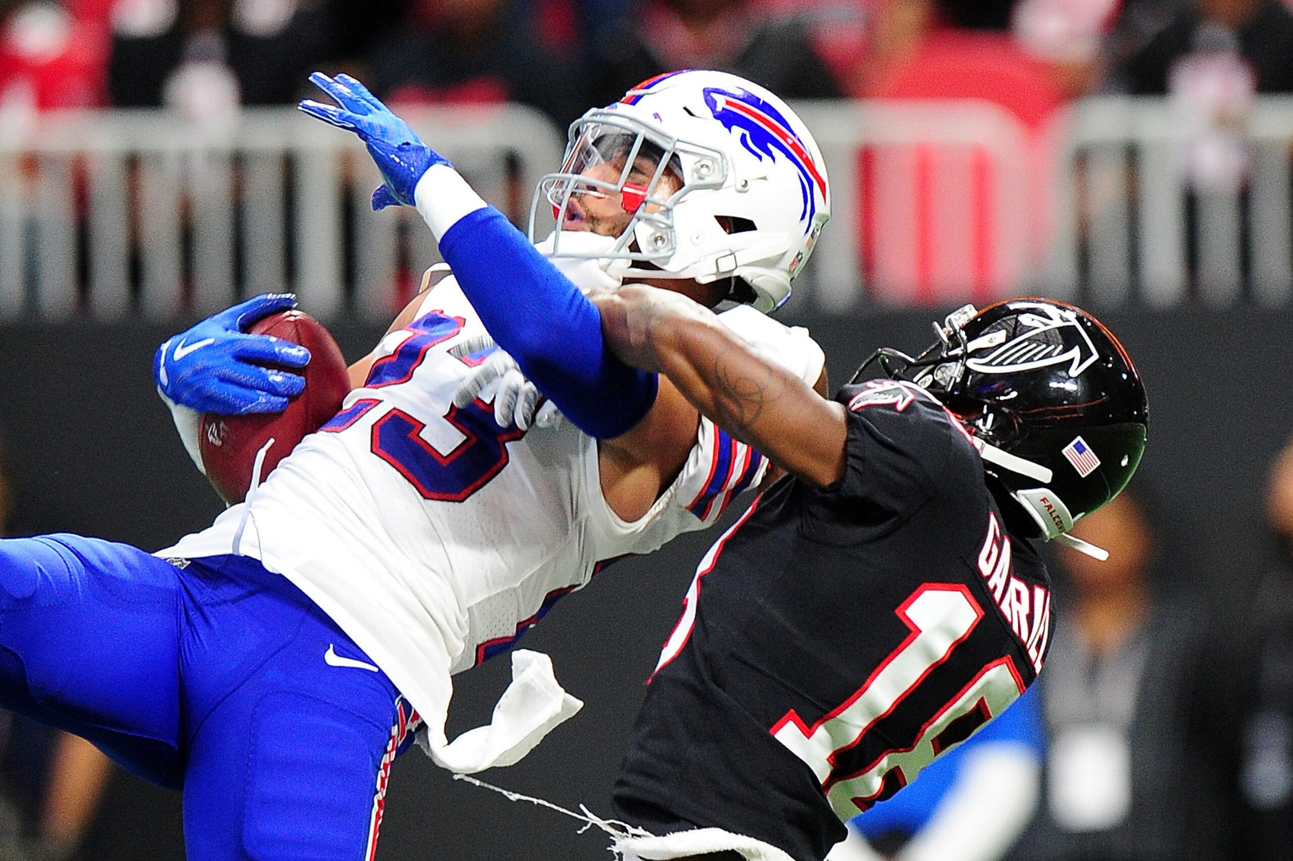 ATLANTA, GA - OCTOBER 01: Micah Hyde #23 of the Buffalo Bills intercepts a pass intended for Taylor Gabriel #18 of the Atlanta Falcons during the second half at Mercedes-Benz Stadium on October 1, 2017 in Atlanta, Georgia. (Photo by Scott Cunningham/Getty