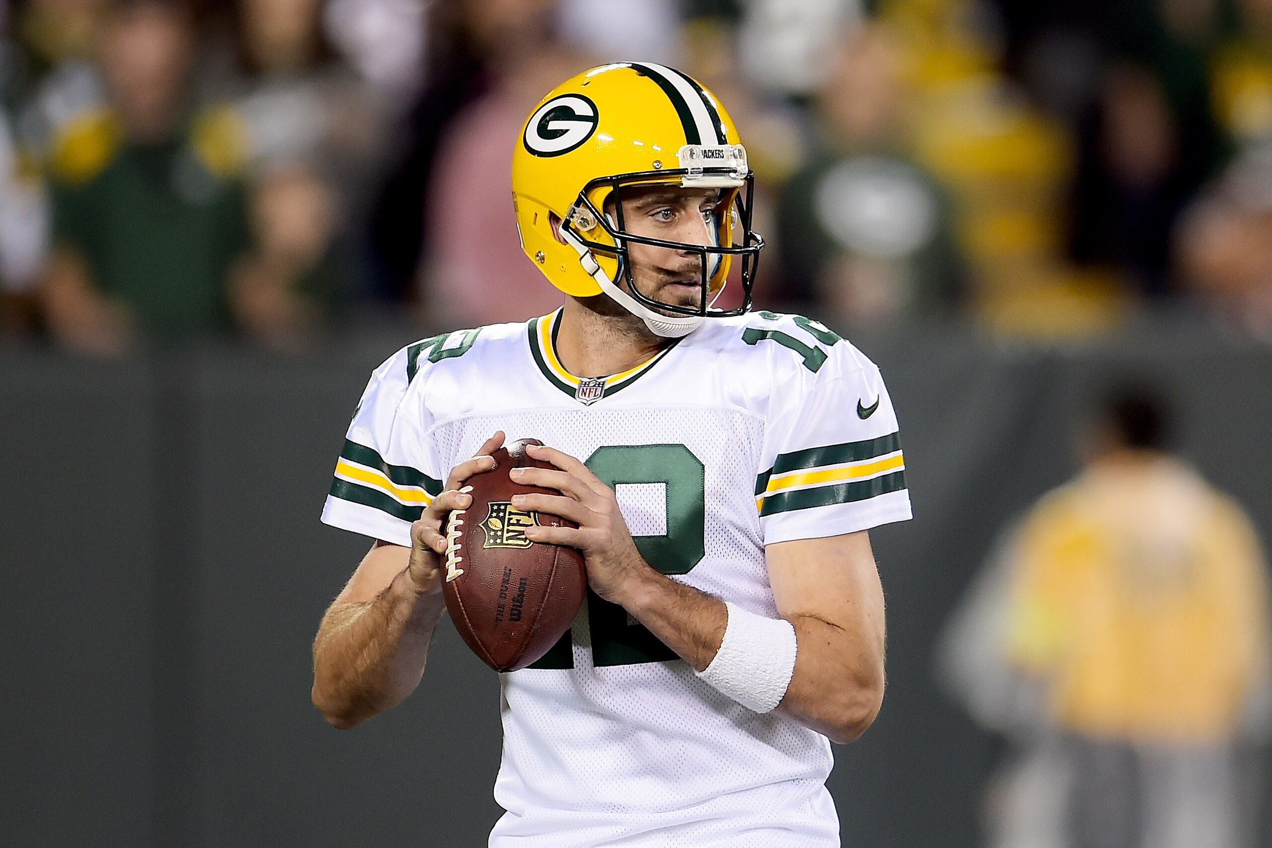 GREEN BAY, WI - SEPTEMBER 28:  Aaron Rodgers #12 of the Green Bay Packers drops back to pass in the second quarter against the Chicago Bears at Lambeau Field on September 28, 2017 in Green Bay, Wisconsin. (Photo by Stacy Revere/Getty Images)