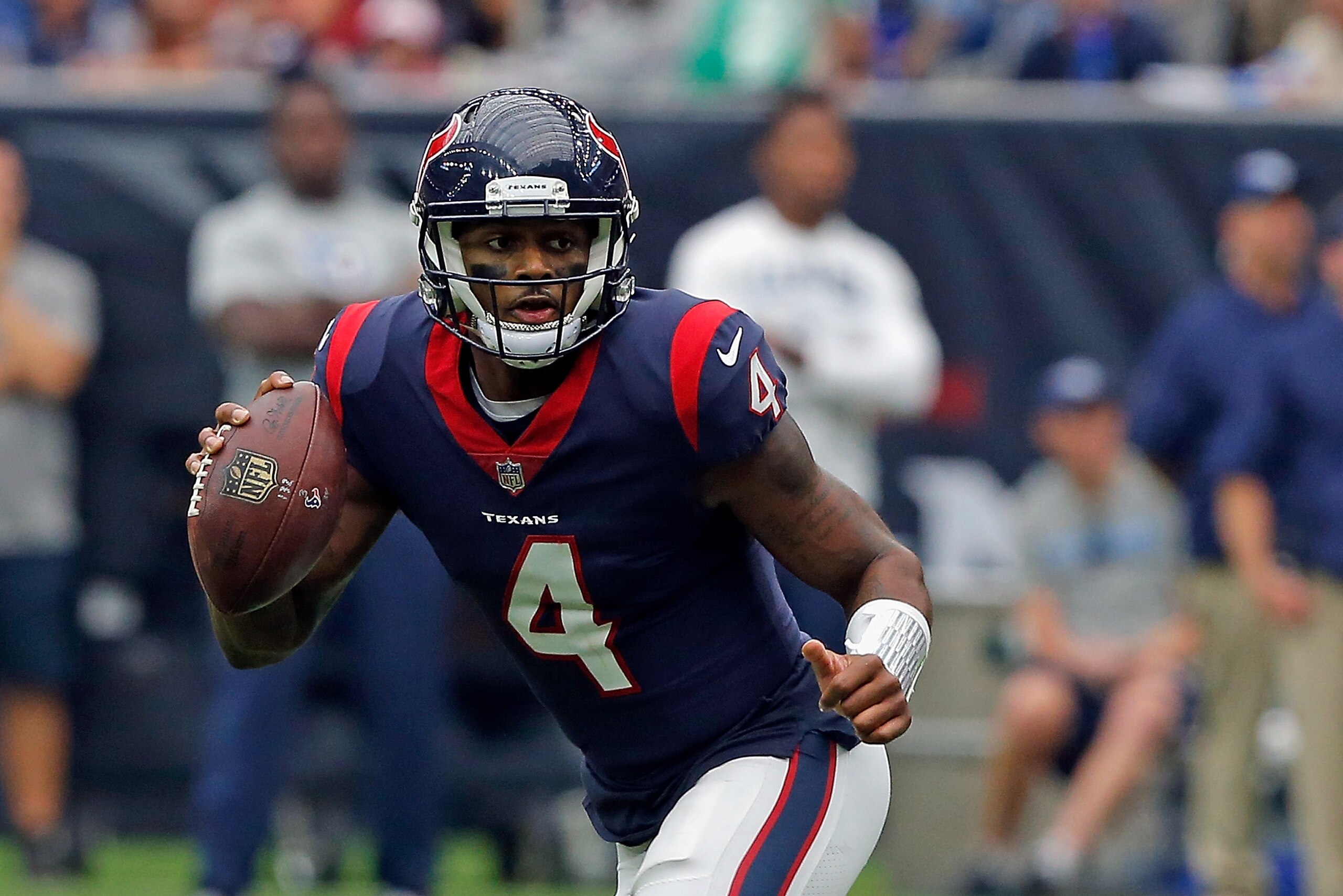 HOUSTON, TX - OCTOBER 01: Deshaun Watson #4 of the Houston Texans rushes out of the pocket against the Tennessee Titans at NRG Stadium on October 1, 2017 in Houston, Texas. Houston won 57-14.  (Photo by Bob Levey/Getty Images)