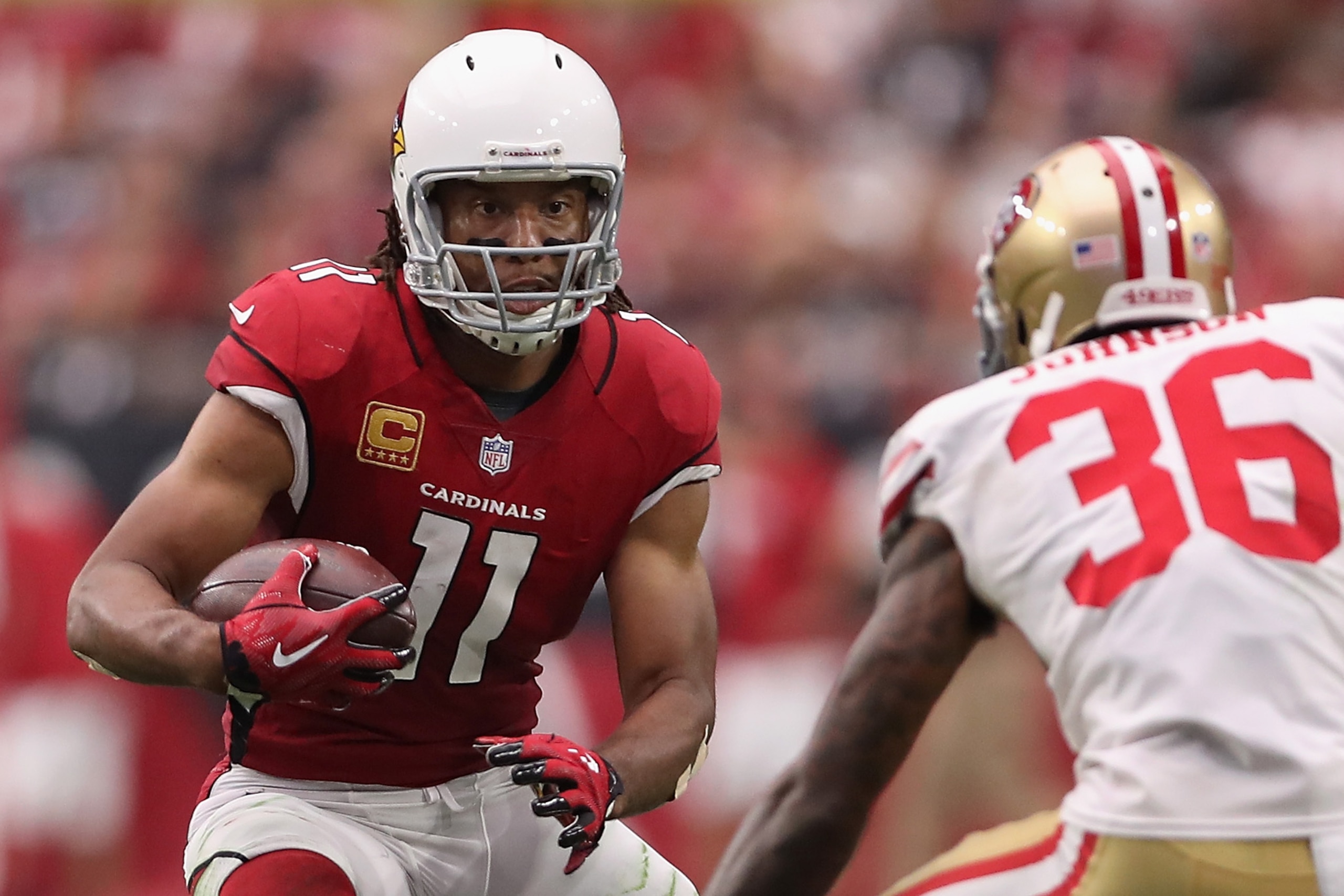 GLENDALE, AZ - OCTOBER 01:  Wide receiver Larry Fitzgerald #11 of the Arizona Cardinals runs with the football after a reception against the San Francisco 49ers during the NFL game at the University of Phoenix Stadium on October 1, 2017 in Glendale, Arizo