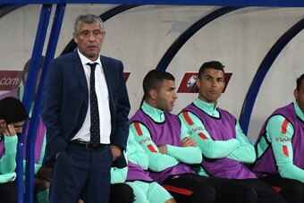 Portugal's forward Cristiano Ronaldo (R) and Portugal's head coach Fernando Santos (L) look on during the FIFA World Cup 2018 football qualifier between Andorra and Portugal at the Municipal Stadium in Andorra la Vella, on October 7, 2017. 
 / AFP PHOTO /