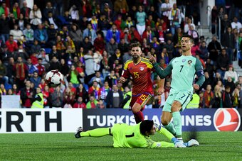 ANDORRA LA VELLA, ANDORRA - OCTOBER 07:  Cristiano Ronaldo of Portugal scores the opening goal past the goalkeeper Josep Gomes of Andorraduring the FIFA 2018 World Cup Qualifier between Andorra and Portugal at the Estadi Nacional on October 7, 2017 in And