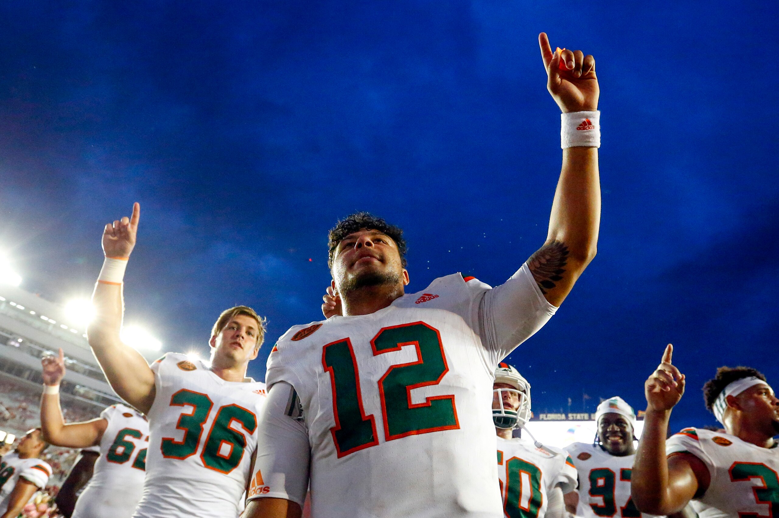 TALLAHASSEE, FL-  OCTOBER 7: Quarterback Malik Rosier #12 of the Miami Hurricanes celebrates with teammates after they defeated the Florida State Seminoles 24-20   during the second half of an NCAA football game at Doak S. Campbell Stadium on October 7, 2