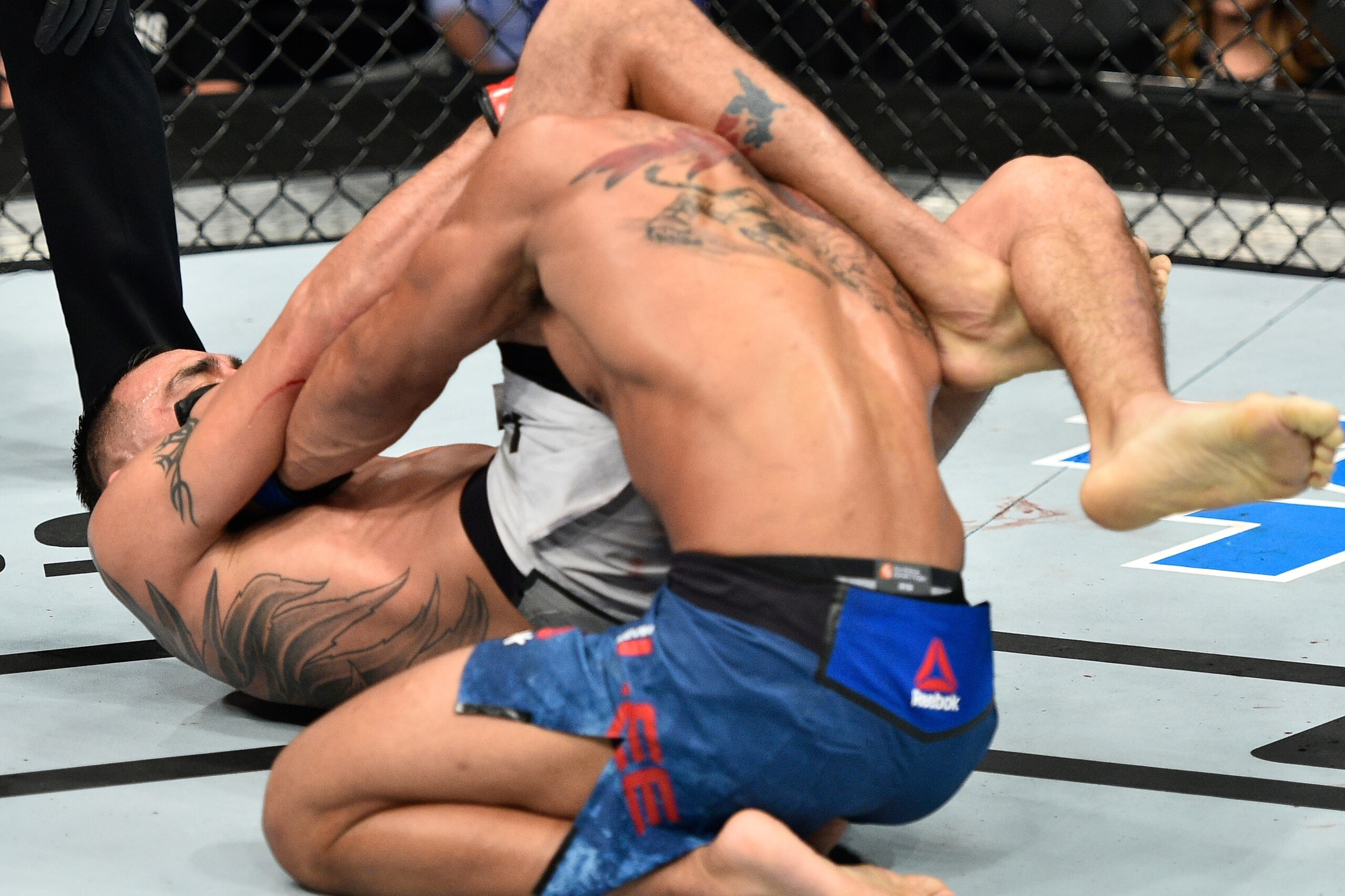 LAS VEGAS, NV - OCTOBER 07:   Tony Ferguson secures a triangle choke submission against Kevin Lee in their interim UFC lightweight championship bout during the UFC 216 event inside T-Mobile Arena on October 7, 2017 in Las Vegas, Nevada. (Photo by Jeff Bot