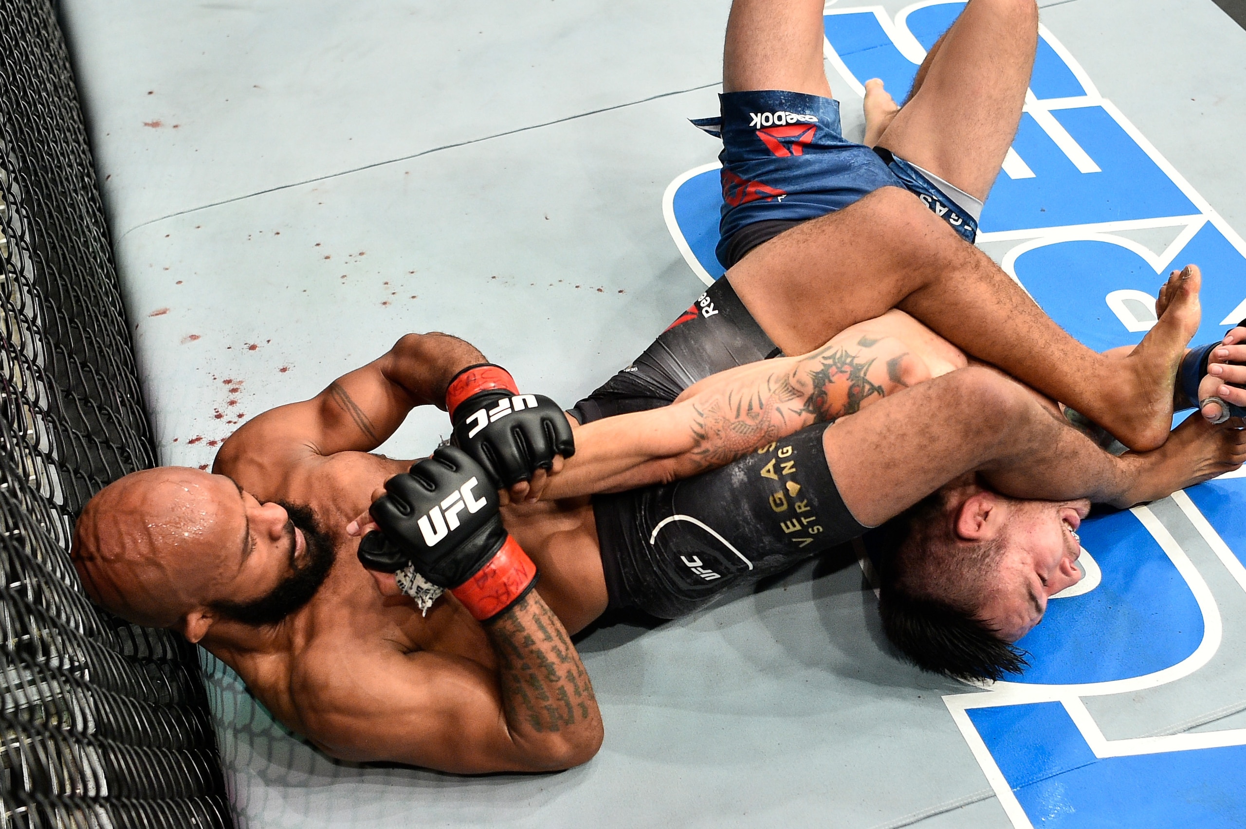LAS VEGAS, NV - OCTOBER 07:   Demetrious Johnson secures an arm bar submission against Ray Borg in their UFC flyweight championship bout during the UFC 216 event inside T-Mobile Arena on October 7, 2017 in Las Vegas, Nevada. (Photo by Jeff Bottari/Zuffa L