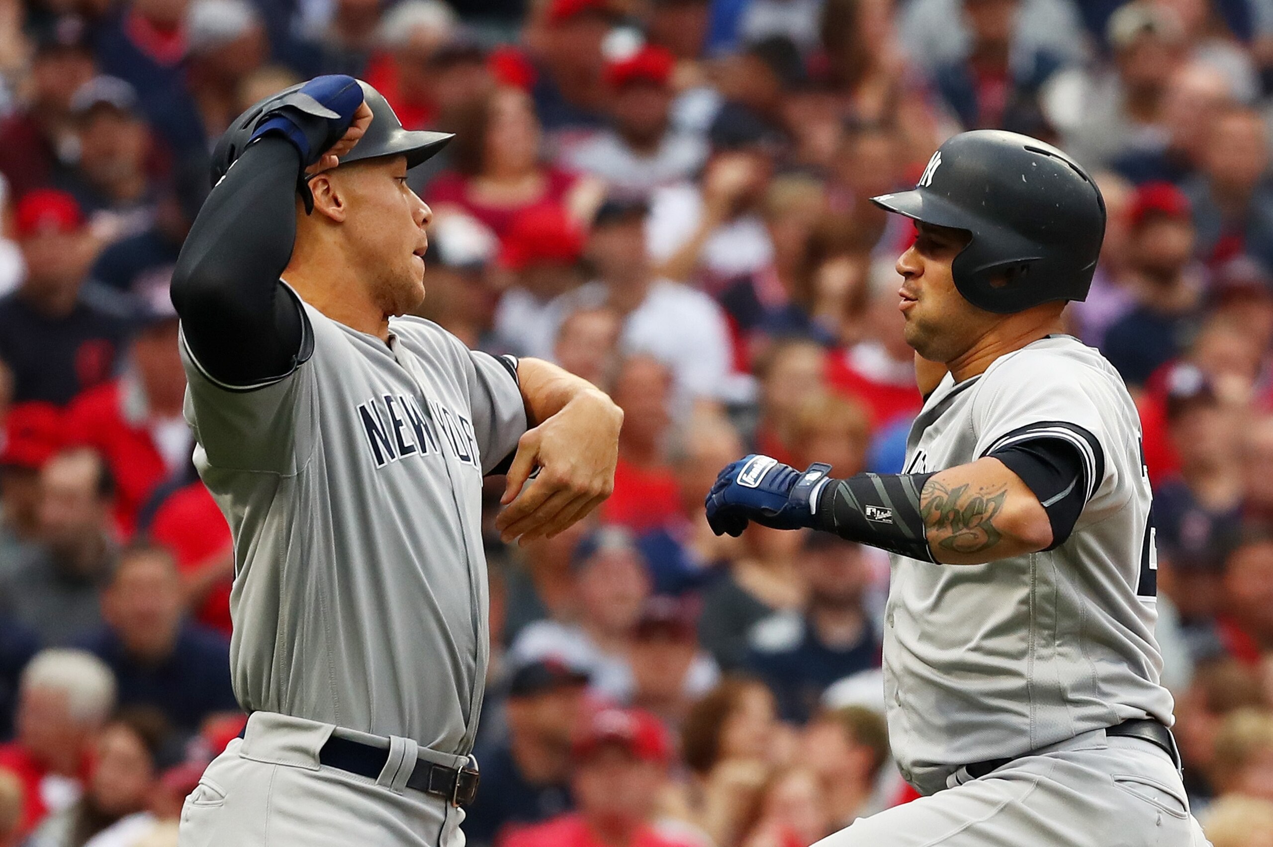 CLEVELAND, OH - OCTOBER 06:  Gary Sanchez #24 celebrates his two-run home run Aaron Judge #99 of the New York Yankees first inning against the Cleveland Indians with during game two of the American League Division Series at Progressive Field on October 6,