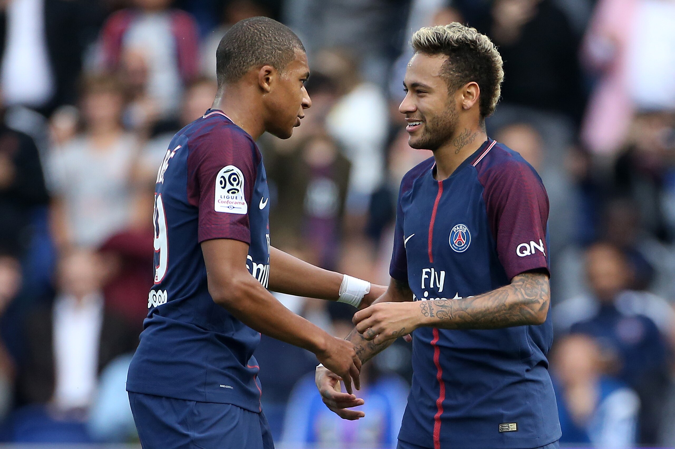 PARIS, FRANCE - SEPTEMBER 30: Neymar Jr of PSG celebrates his second goal with Kylian Mbappe (left) during the French Ligue 1 match between Paris Saint-Germain (PSG) and FC Girondins de Bordeaux at Parc des Princes on September 30, 2017 in Paris, France. PARIS, FRANCE - SEPTEMBER 30: Neymar Jr of PSG celebrates his second goal with Kylian Mbappe (left) during the French Ligue 1 match between Paris Saint-Germain (PSG) and FC Girondins de Bordeaux at Parc des Princes on September 30, 2017 in Paris, France.
