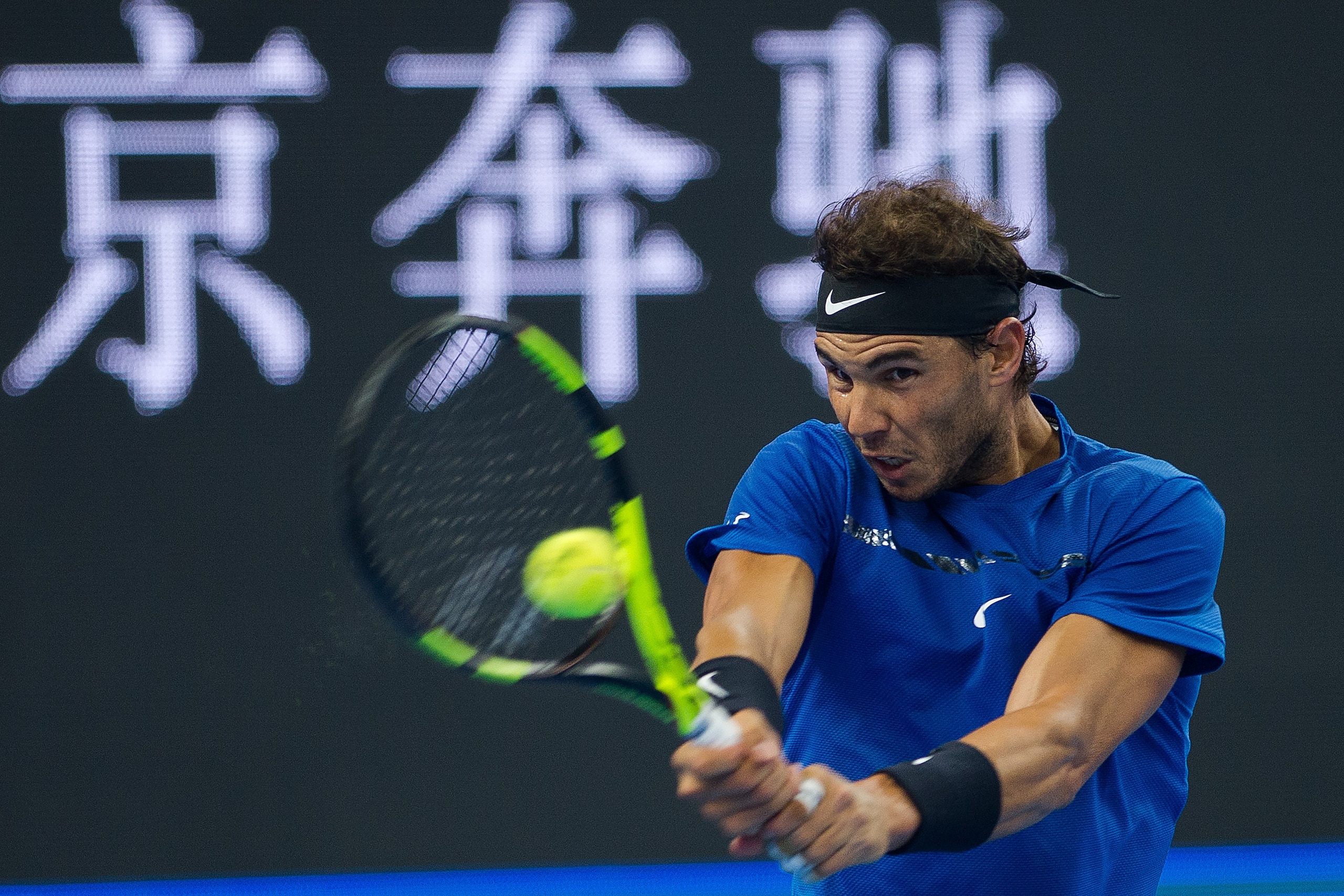 Rafael Nadal of Spain hits a return during his men's singles final match against Nick Kyrgios of Australia at the China Open tennis tournament in Beijing on October 8, 2017. / AFP PHOTO / NICOLAS ASFOURI        (Photo credit should read NICOLAS ASFOURI/AF