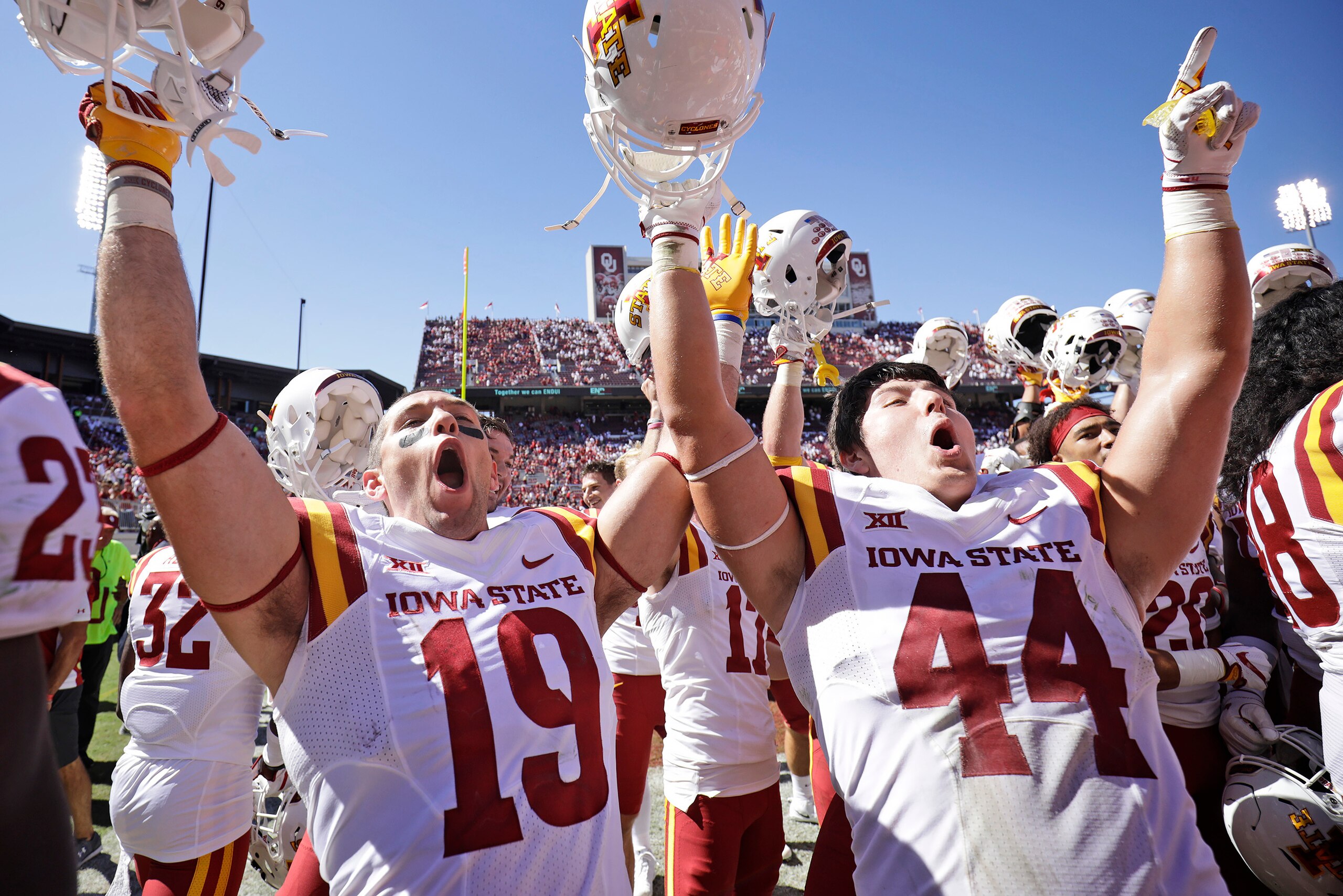 NORMAN, OK - OCTOBER 07: Wide receiver Trever Ryen #19 and linebacker Bobby McMillen III #44 of the Iowa State Cyclones celebrate after the game against the Oklahoma Sooners at Gaylord Family Oklahoma Memorial Stadium on October 7, 2017 in Norman, Oklahom