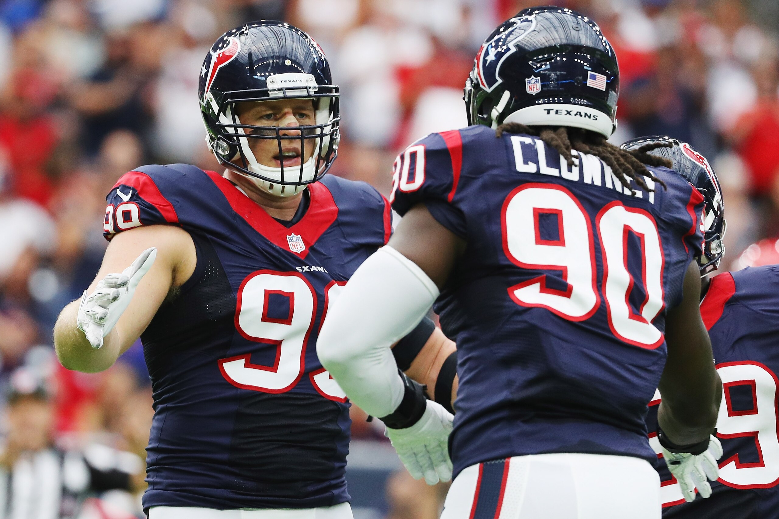 HOUSTON, TX - SEPTEMBER 18:  J.J. Watt #99 and  Jadeveon Clowney #90 of the Houston Texans celebrate a play in the first quarter of their game against the Kansas City Chiefs at NRG Stadium on September 18, 2016 in Houston, Texas.  (Photo by Scott Halleran