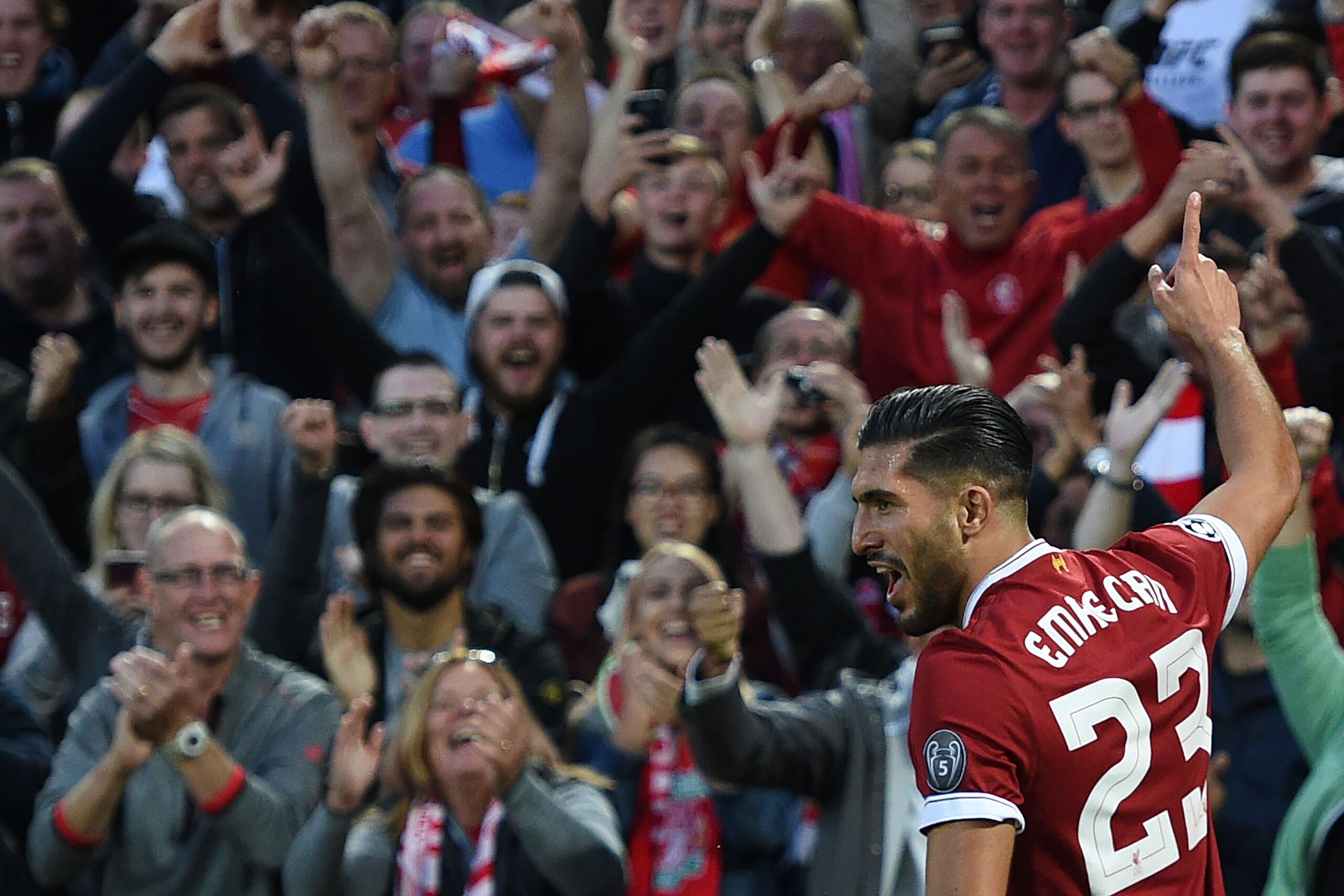 Liverpool's German midfielder Emre Can celebrates scoring the team's first goal during the Champions League qualifier, second leg match between Liverpool and Hoffenheim at Anfield stadium in Liverpool on August 23, 2017. / AFP PHOTO / Oli SCARFF (P Liverpool's German midfielder Emre Can celebrates scoring the team's first goal during the Champions League qualifier, second leg match between Liverpool and Hoffenheim at Anfield stadium in Liverpool on August 23, 2017. / AFP PHOTO / Oli SCARFF (P