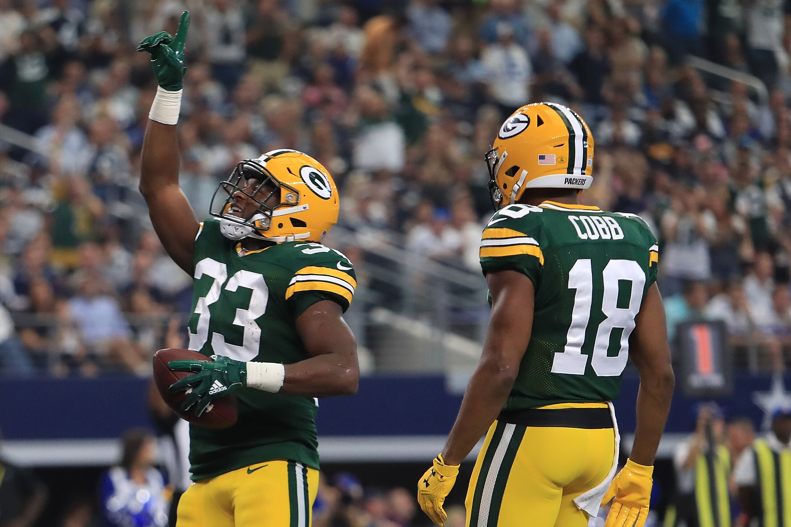 ARLINGTON, TX - OCTOBER 08: Aaron Jones #33 celebrates a touchdown with Randall Cobb #18 of the Green Bay Packers in the second quarter against the Dallas Cowboys at AT&T Stadium on October 8, 2017 in Arlington, Texas. (Photo by Ronald Martinez/Getty Im ARLINGTON, TX - OCTOBER 08: Aaron Jones #33 celebrates a touchdown with Randall Cobb #18 of the Green Bay Packers in the second quarter against the Dallas Cowboys at AT&T Stadium on October 8, 2017 in Arlington, Texas. (Photo by Ronald Martinez/Getty Im