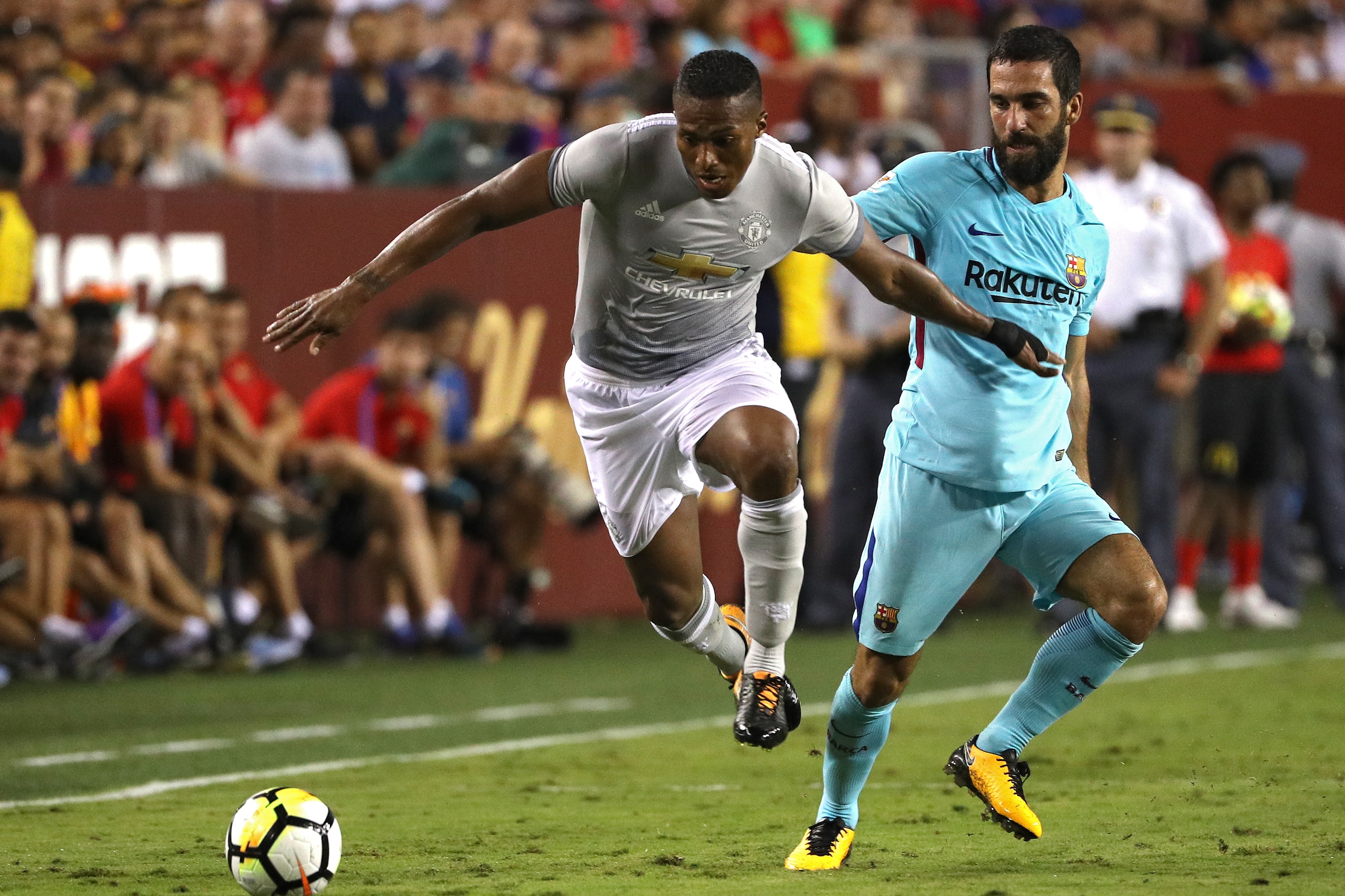 LANDOVER, MD - JULY 26: Luis Antonio Valencia #25 of Manchester United and Arda Turan #7 of Barcelona battle for the ball in the second half during the International Champions Cup match at FedExField on July 26, 2017 in Landover, Maryland. (Photo by Patri