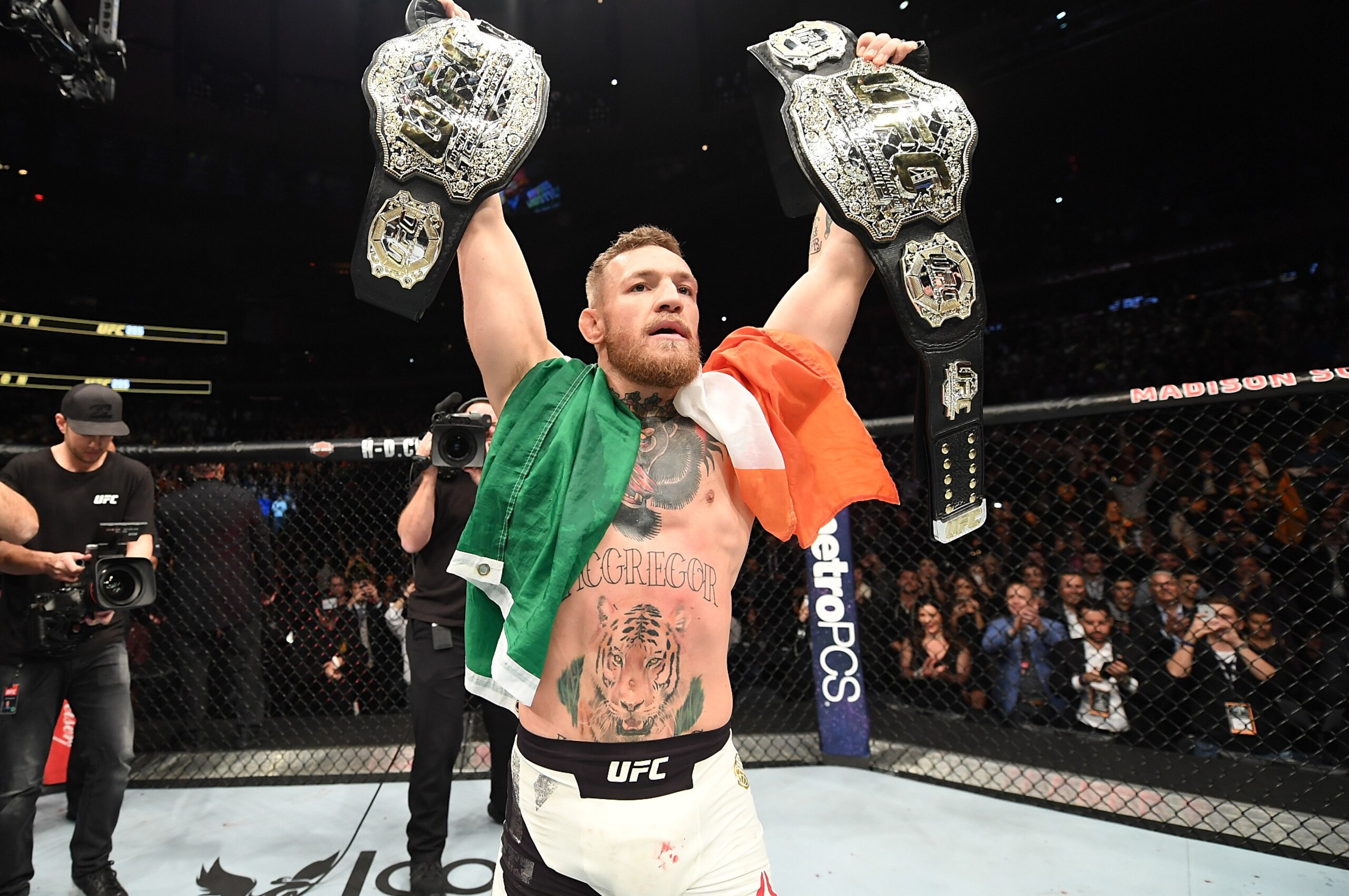 NEW YORK, NY - NOVEMBER 12:  UFC lightweight and featherweight champion Conor McGregor of Ireland celebrates after defeating Eddie Alvarez in their UFC lightweight championship fight during the UFC 205 event at Madison Square Garden on November 12, 2016 i