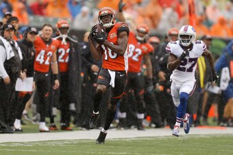 CINCINNATI, OH - OCTOBER 8:  A.J. Green #18 of the Cincinnati Bengals catches a pass and runs it in for a touchdown while being defended by Tre'Davious White #27 of the Buffalo Bills during the first quarter at Paul Brown Stadium on October 8, 2017 in Cin