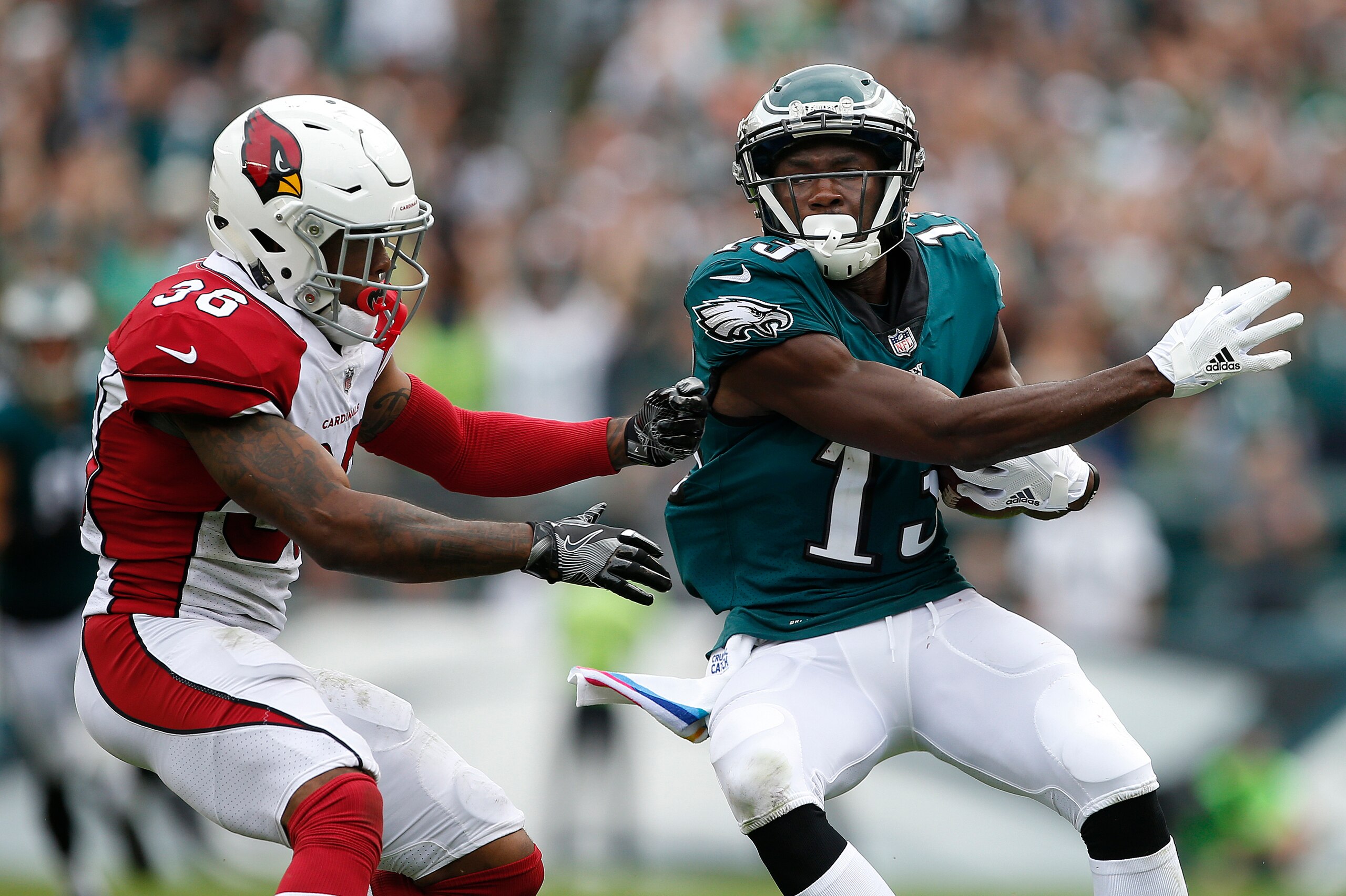PHILADELPHIA, PA - OCTOBER 08: Nelson Agholor #13 of the Philadelphia Eagles makes a 72-yard catch and runs the ball in for a touchdown as Budda Baker #36 the Arizona Cardinals during the third quarter at Lincoln Financial Field on October 8, 2017 in Phil