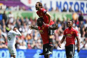 SWANSEA, WALES - AUGUST 19: Romelu Lukaku of Manchester United celebrates scoring hisw sides second goal with Daley Blind of Manchester United during the Premier League match between Swansea City and Manchester United at Liberty Stadium on August 19, 2017