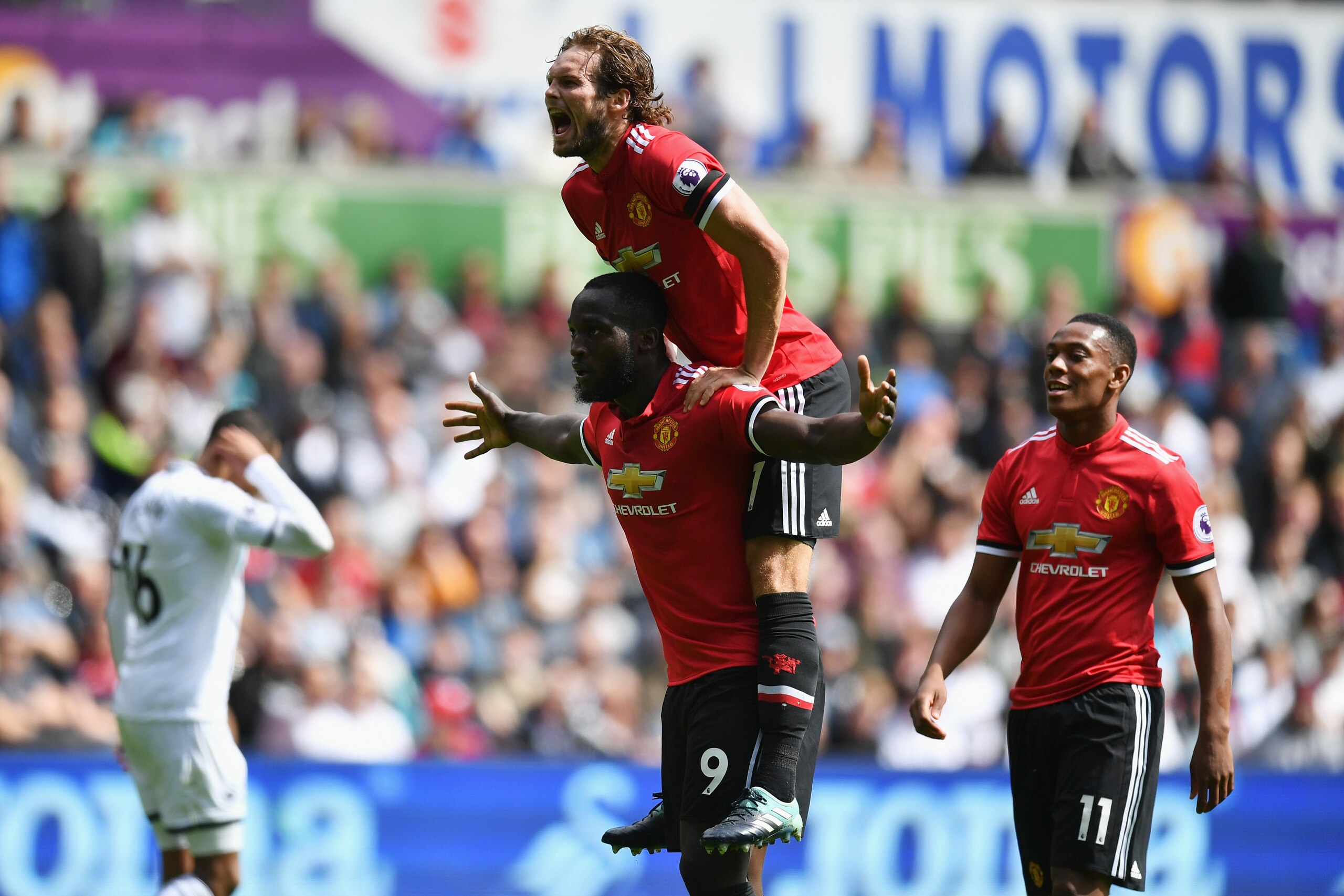 SWANSEA, WALES - AUGUST 19: Romelu Lukaku of Manchester United celebrates scoring hisw sides second goal with Daley Blind of Manchester United during the Premier League match between Swansea City and Manchester United at Liberty Stadium on August 19, 2017