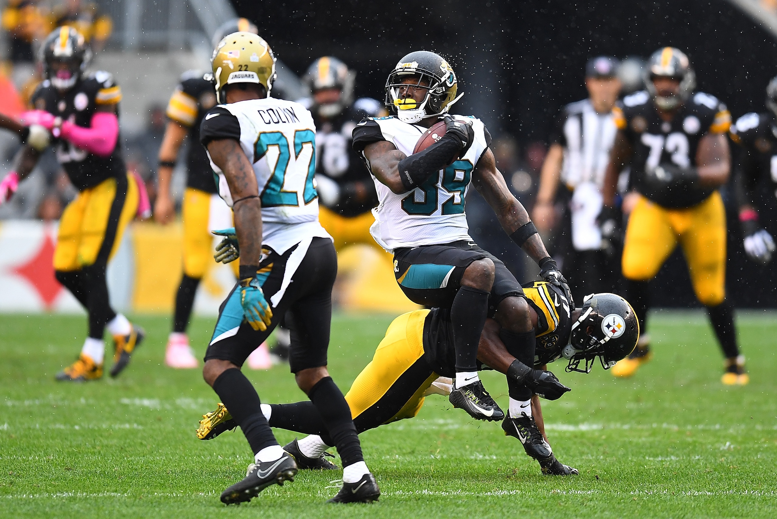 PITTSBURGH, PA - OCTOBER 08: Tashaun Gipson #39 of the Jacksonville Jaguars is tackled by JuJu Smith-Schuster #19 of the Pittsburgh Steelers after a 2 yard interception return in the fourth quarter during the game at Heinz Field on October 8, 2017 in Pitt