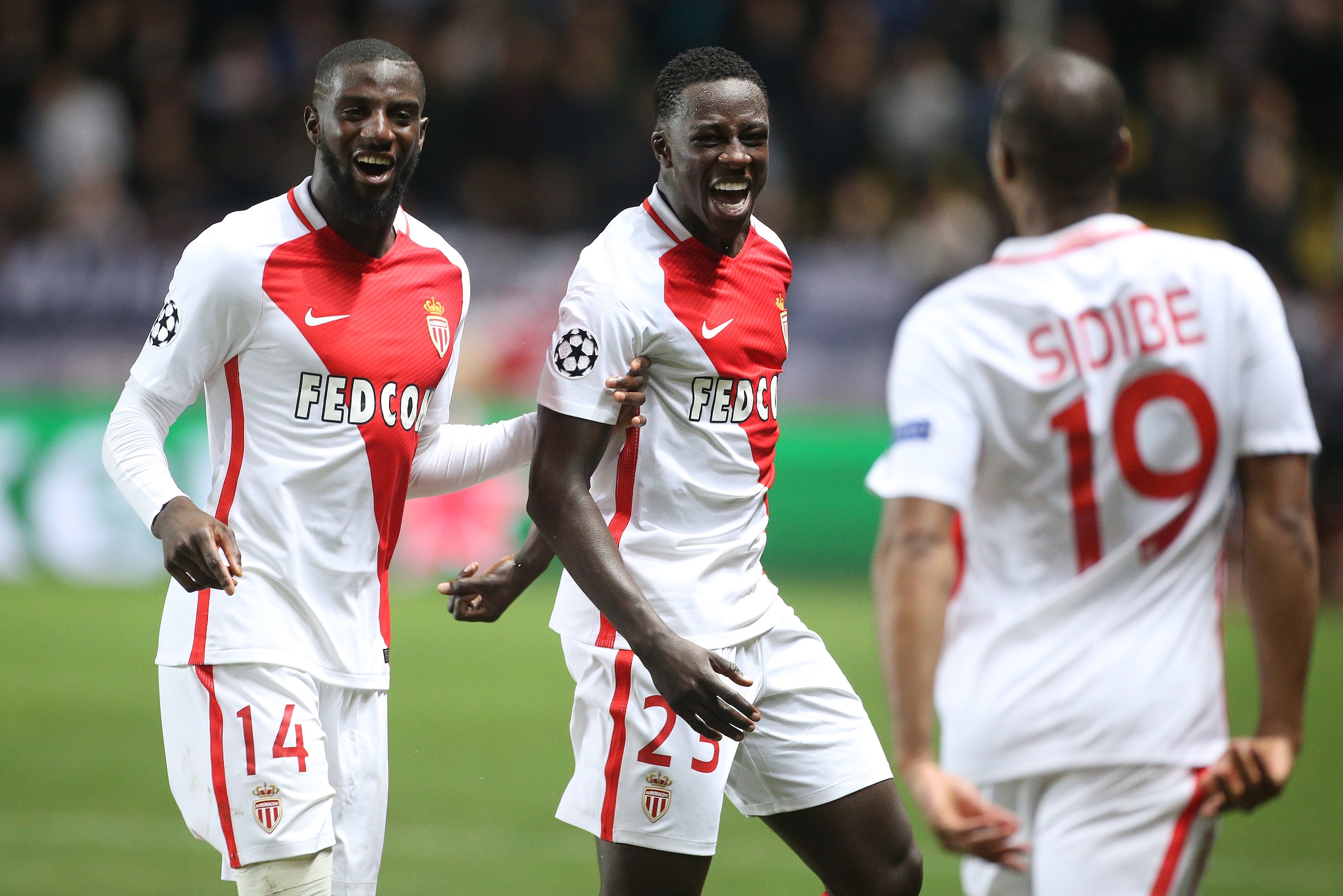 MONACO, MONACO - NOVEMBER 22: Djibril Sidibe of Monaco (#19) celebrates his goal with Tiemoue Bakayoko and Benjamin Mendy during the UEFA Champions League match between AS Monaco FC and Tottenham Hotspur FC at Stade Louis II on November 22, 2016 in Monaco