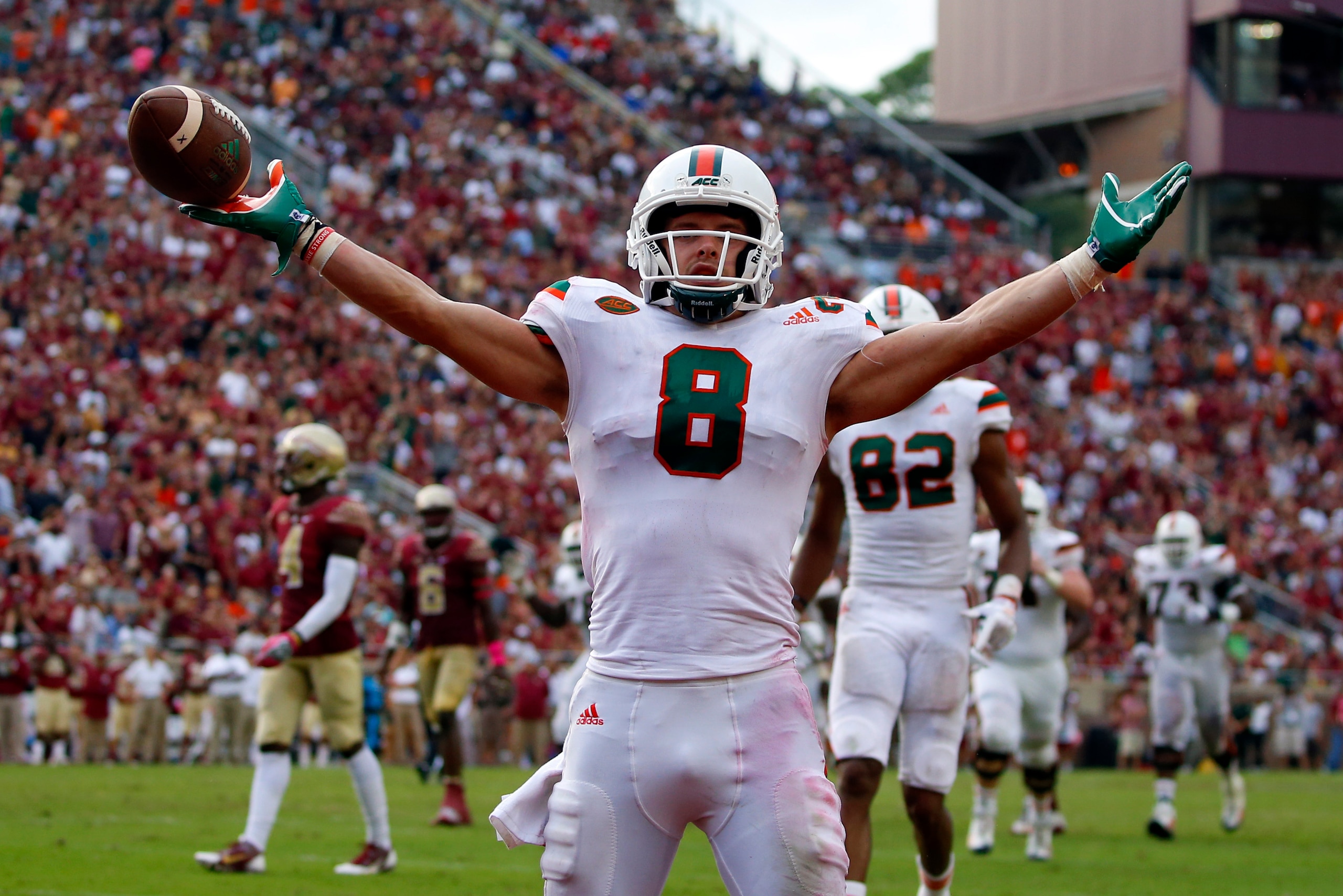 TALLAHASSEE, FL - OCTOBER 7:    Wide receiver Braxton Berrios #8 of the Miami Hurricanes celebrates after scoring a touchdown during the second half of an NCAA football game against the Florida State Seminoles at Doak S. Campbell Stadium on October 7, 201