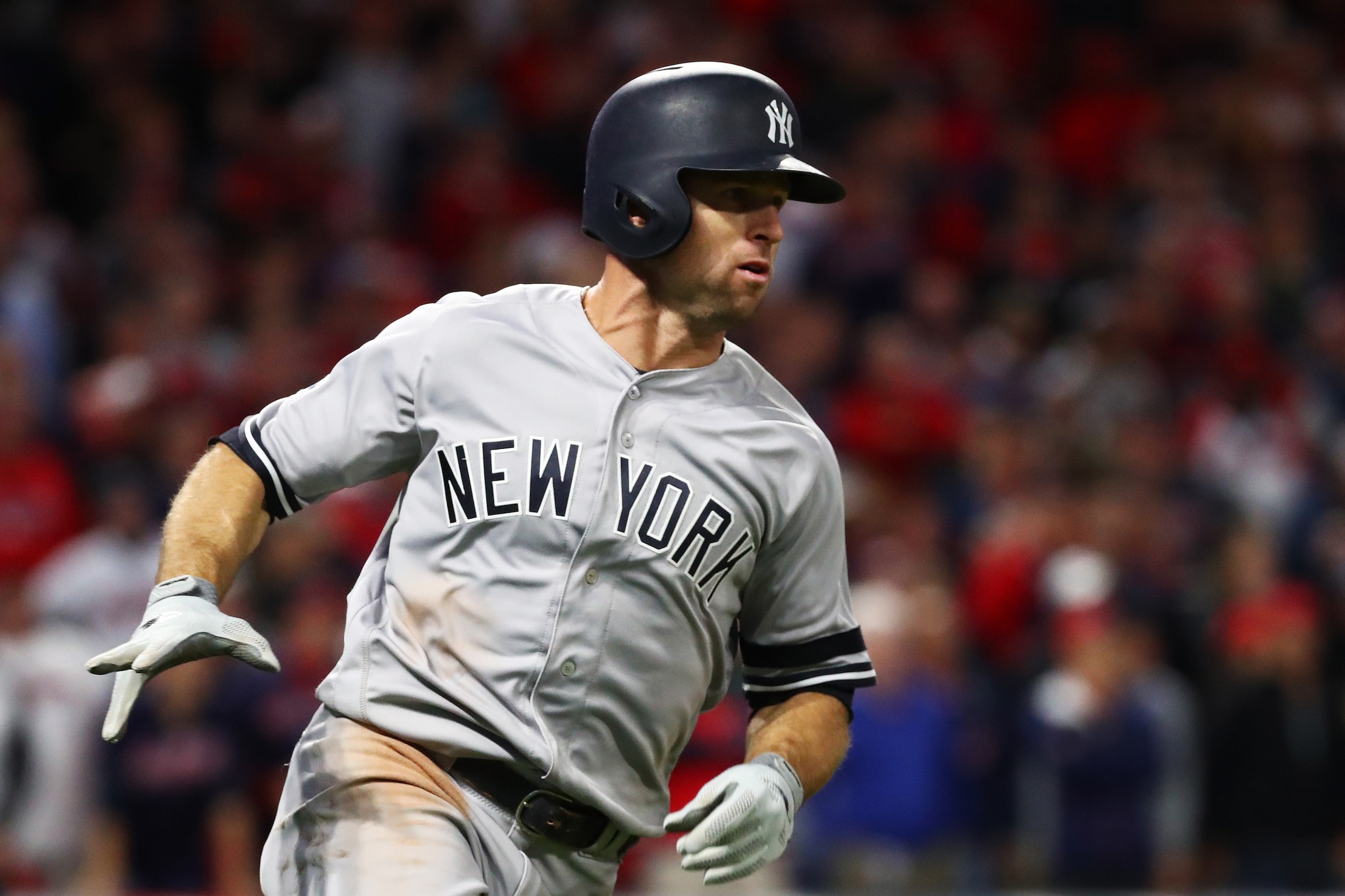 CLEVELAND, OH - OCTOBER 11:  Brett Gardner #11 of the New York Yankees runs to first after hitting a two RBI single in the ninth inning against the Cleveland Indians in Game Five of the American League Divisional Series at Progressive Field on October 11,