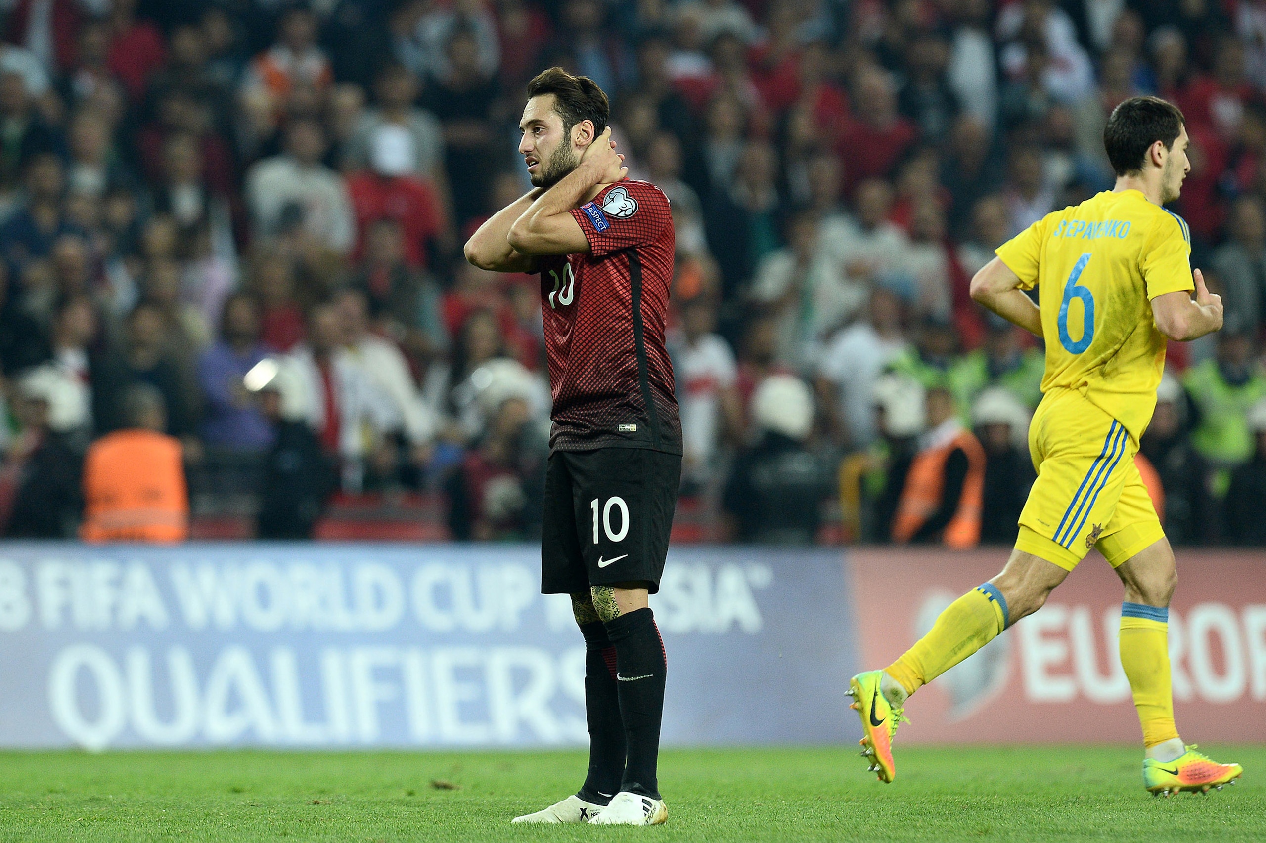 Turkey's Hakan Calhanoglu (L) reacts during the World Cup 2018 football qualification match between Turkey and Ukraine on October 6, 2016 at Konya arena stadium in Konya.  / AFP / STRINGER        (Photo credit should read STRINGER/AFP/Getty Images)