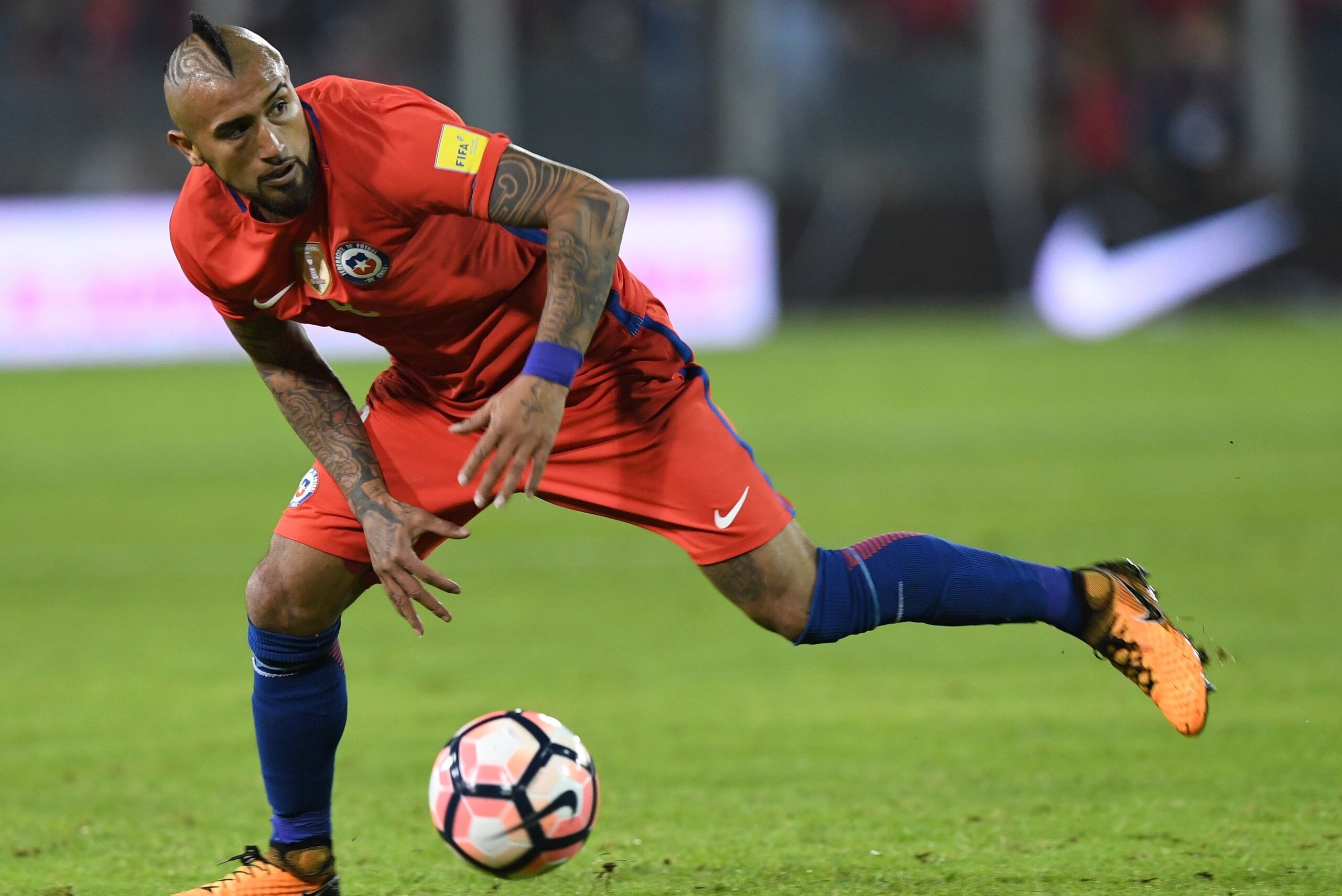 Chile's Arturo Vidal takes the ball during the 2018 World Cup qualifier football match against Ecuador in Santiago on October 5, 2017. / AFP PHOTO / Martin BERNETTI        (Photo credit should read MARTIN BERNETTI/AFP/Getty Images)
